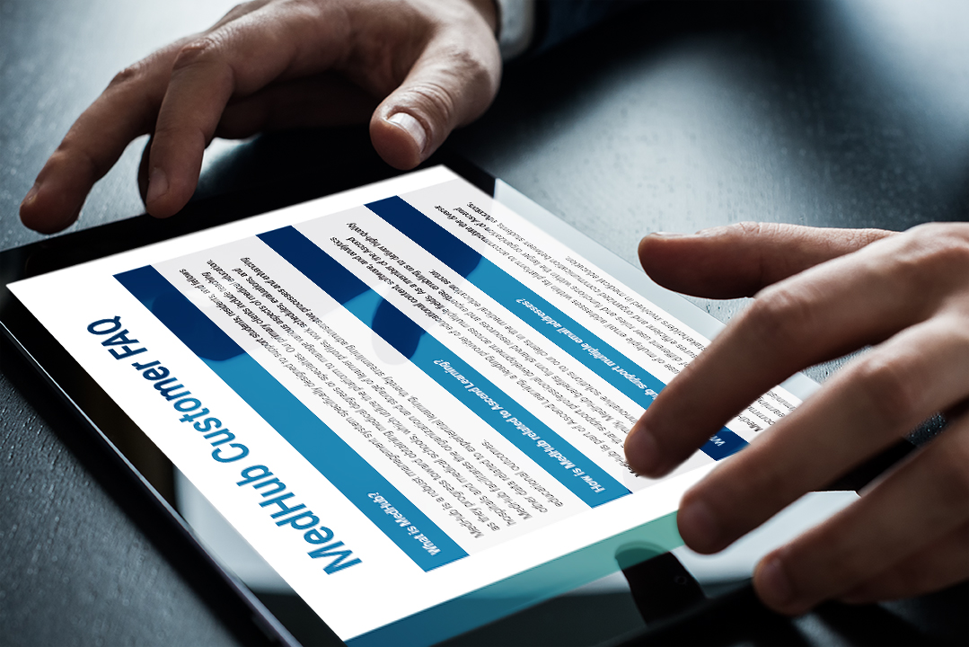 Person viewing MedHub FAQ on a tablet