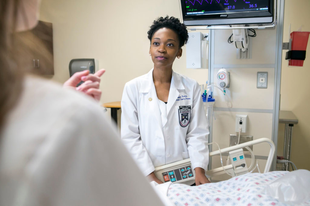 Person viewing MedHub FAQ on a tablet