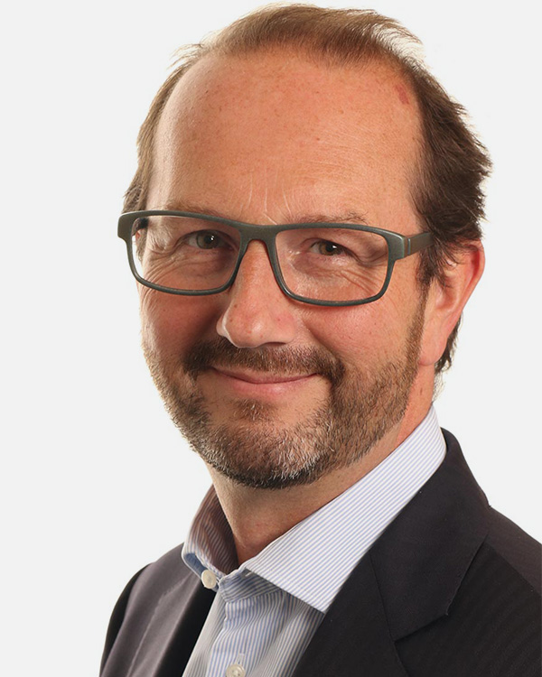photo of Emmanuel Hadjidakis - glasses and red tie
