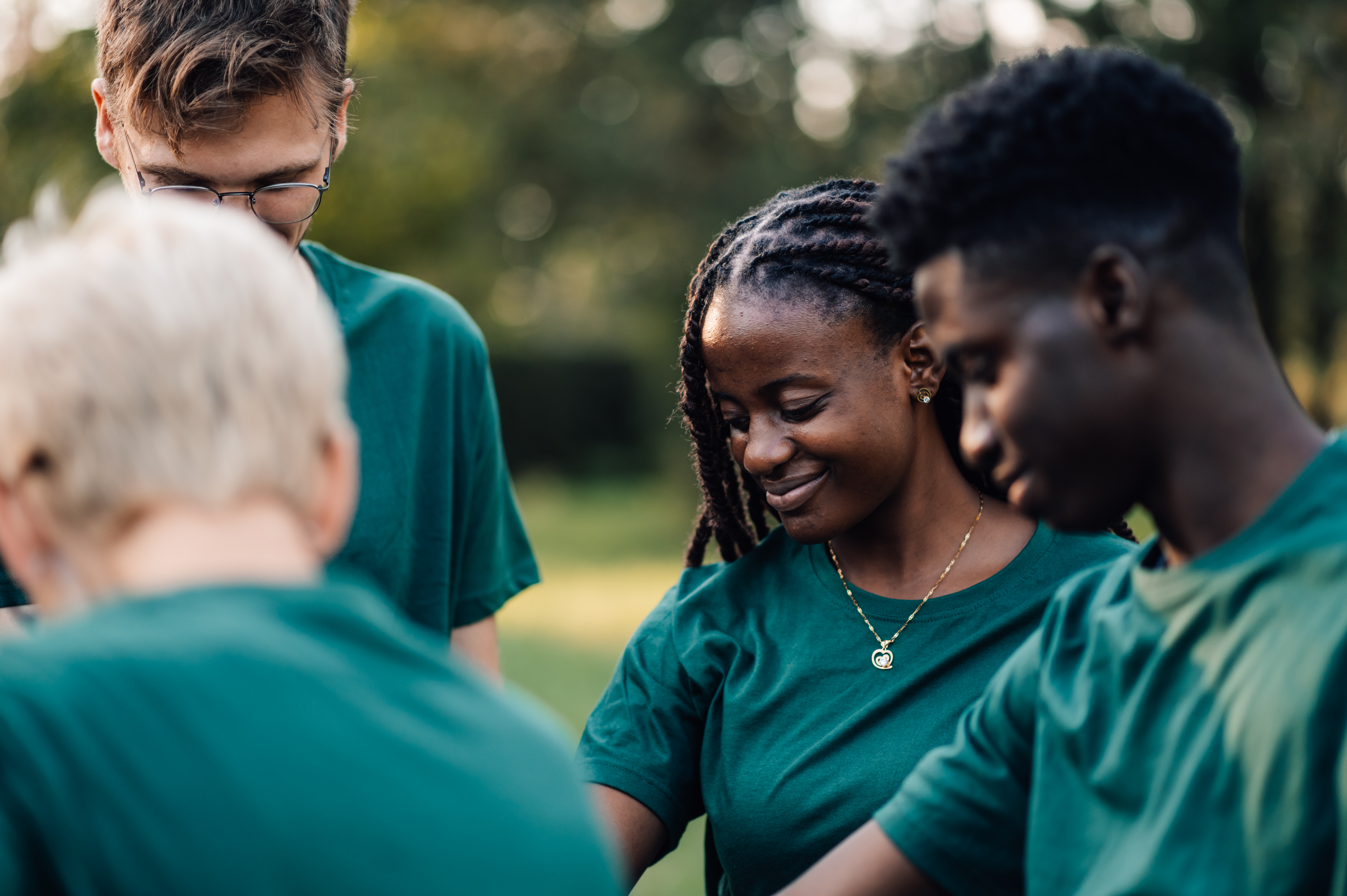Group of volunteers in green t-shirts