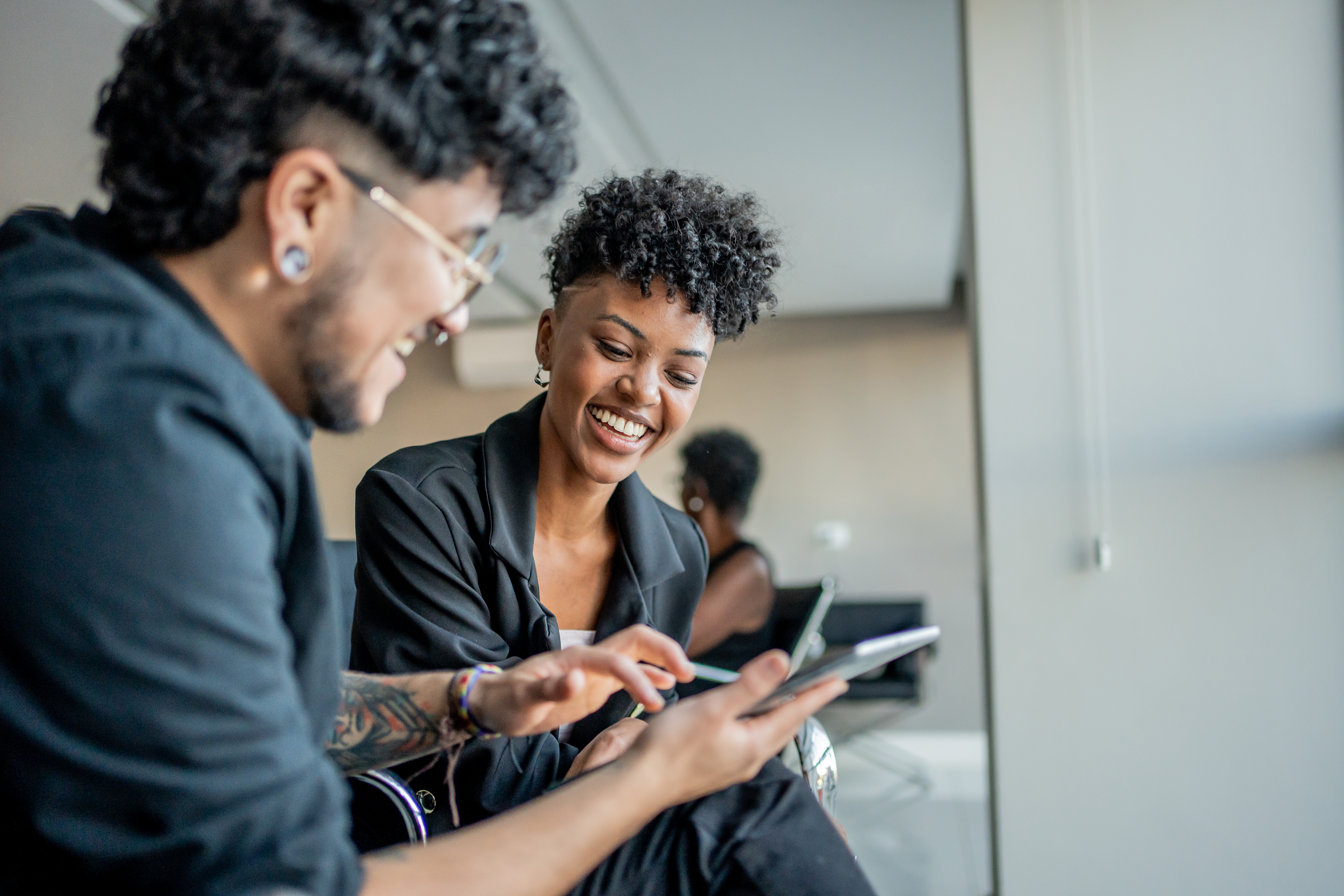Young male employee looking at his laptop