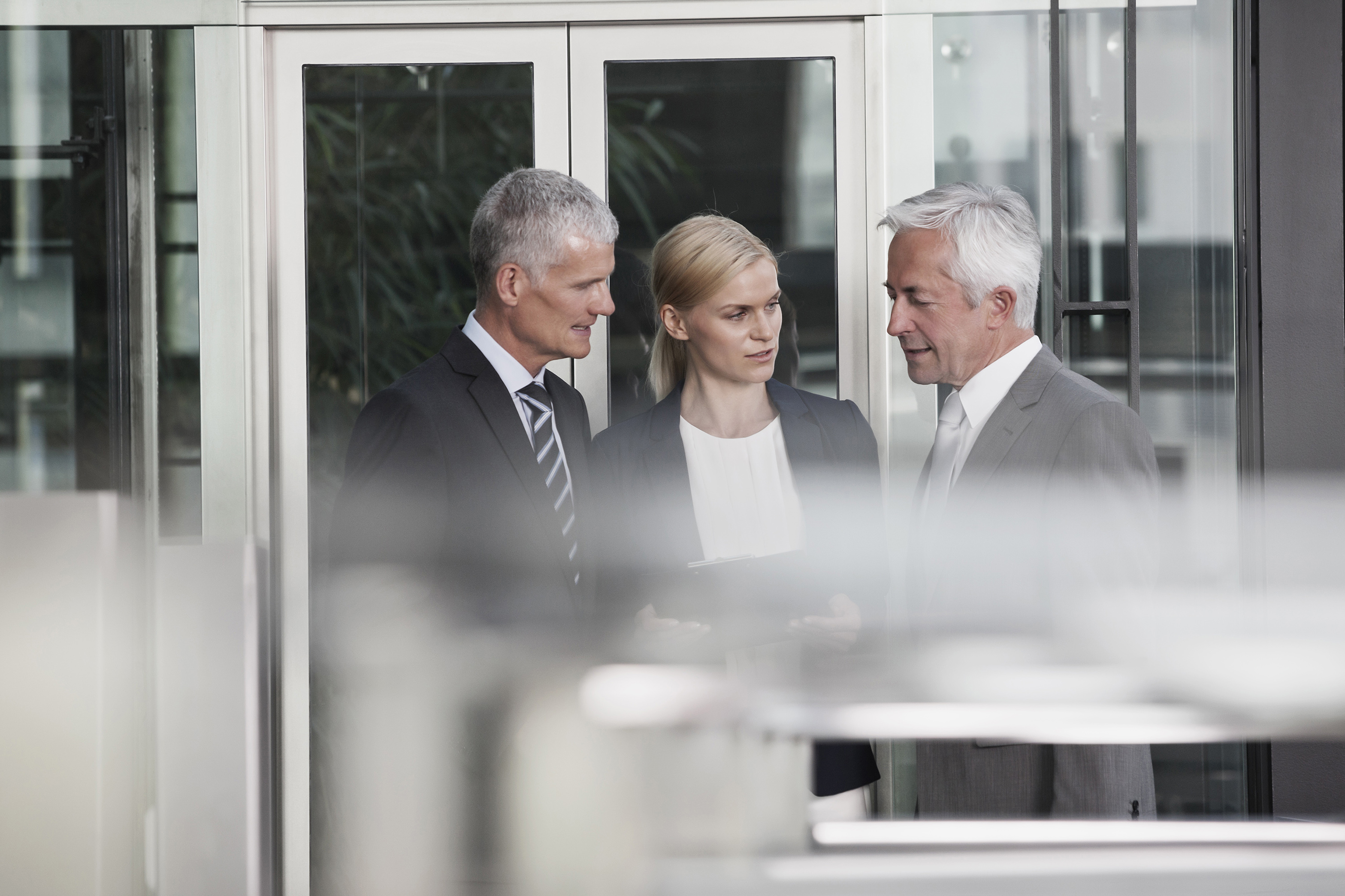 Young creatives and team leader in discussion in an open working environment