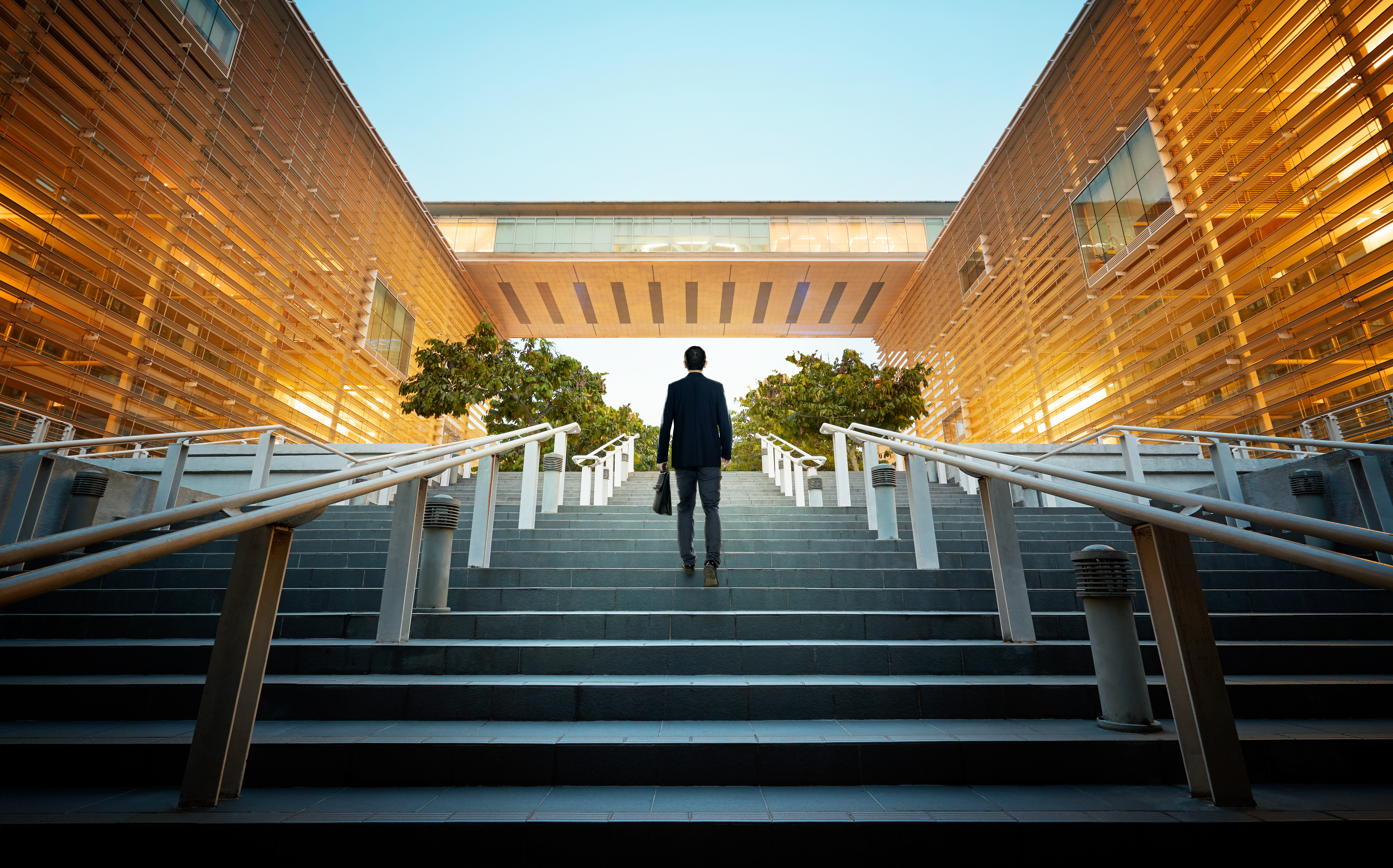 Horizontal shot of young man sitting in meeting room. Businessman sitting in board room during new project discussion.