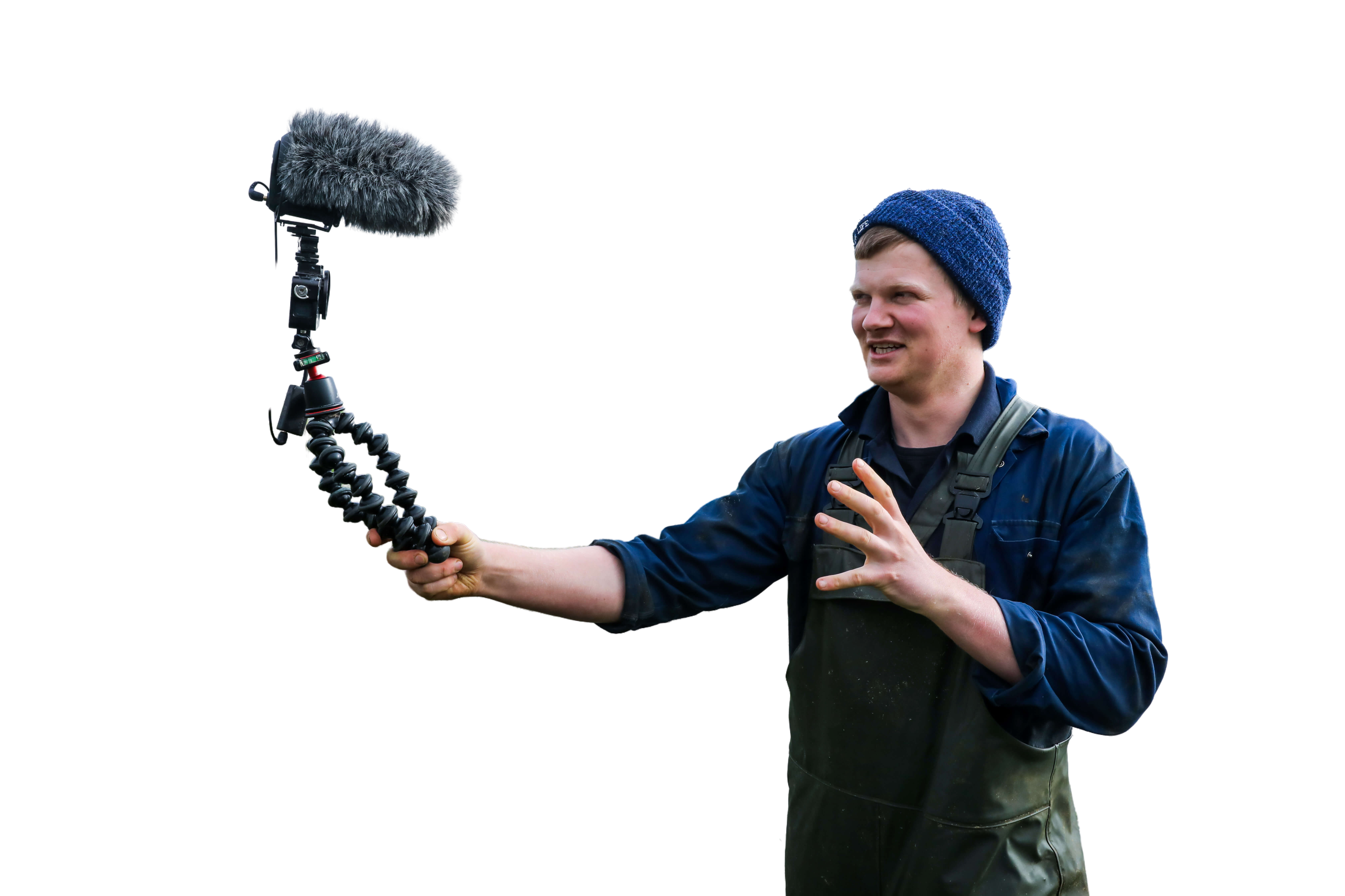 Tom Pemberton on his farm in Lytham St Annes, Lancashire vlogging to camera in a wet field