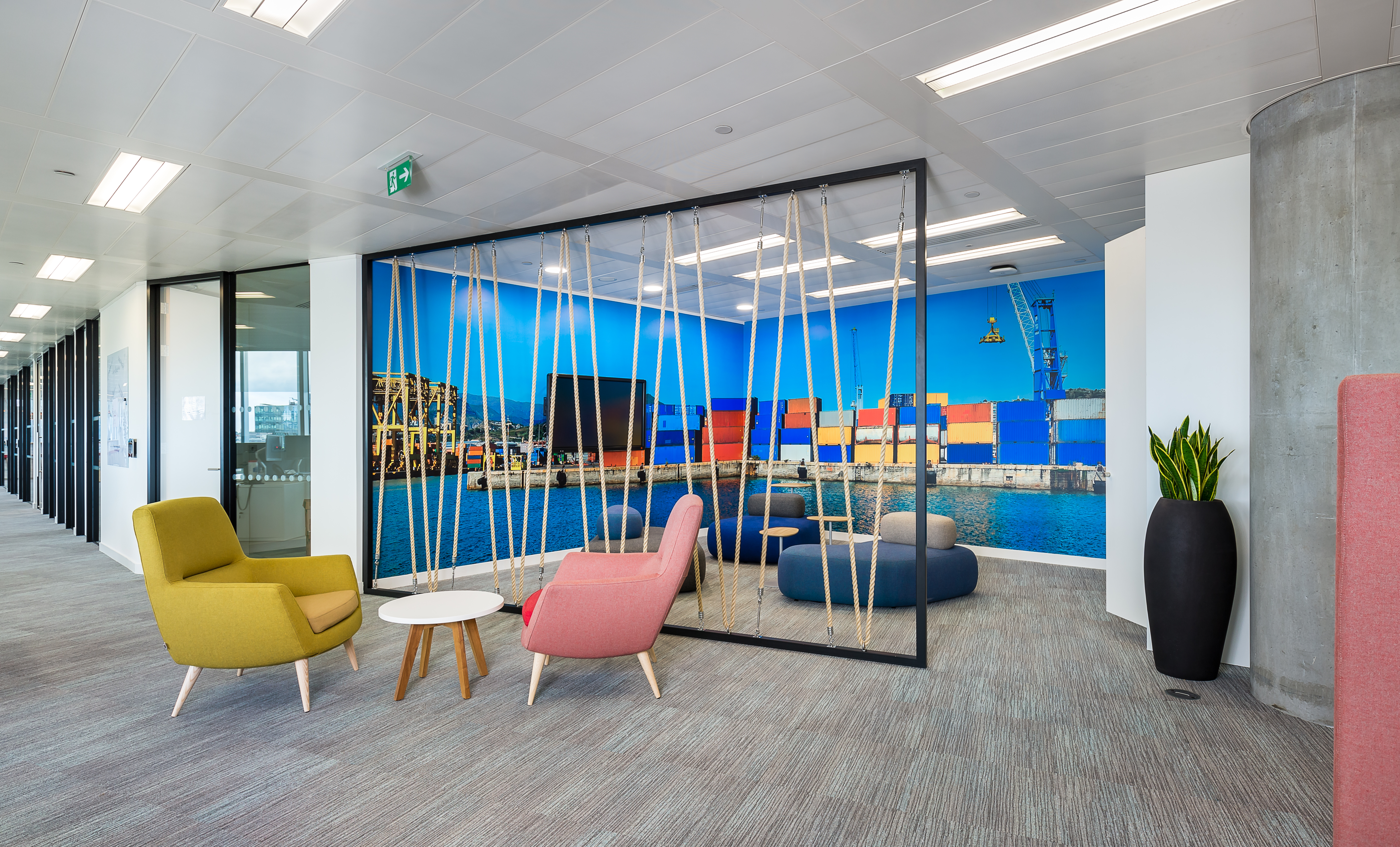 Interior of open space office of modern company with rows of computer desks and meeting room. Mock up wall on the left. 3d rendering