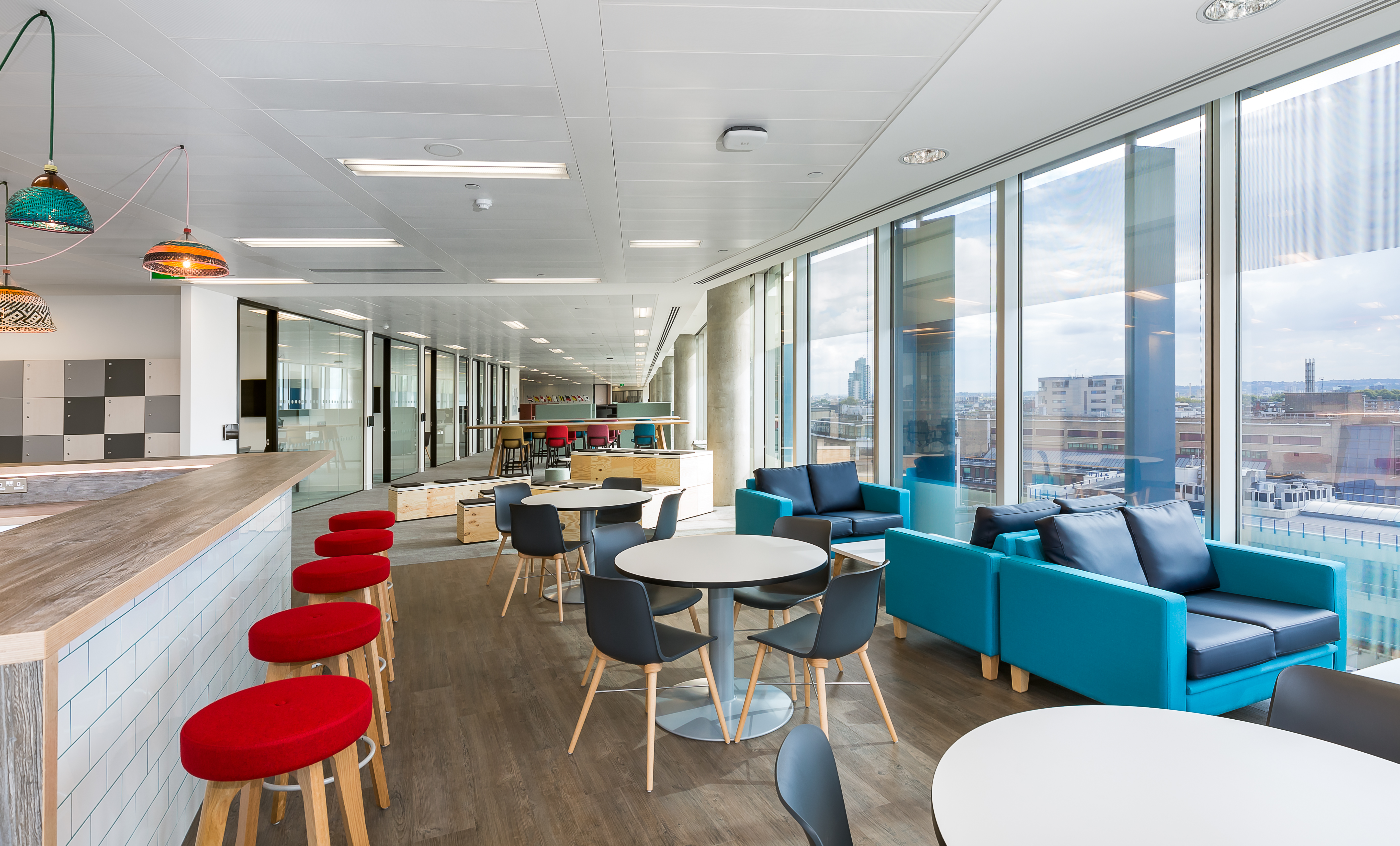 Office or university building blur background exterior view with blurry empty lobby space, entrance hall glass wall window and light bokeh