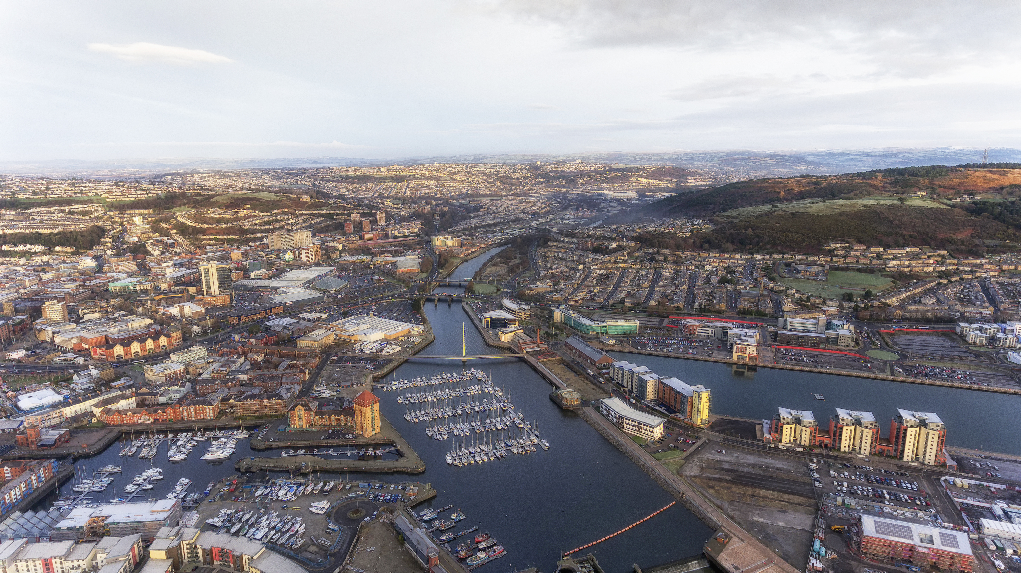 Editorial SWANSEA, UK - DECEMBER 12, 2017: An aerial view of the River Tawe in Swansea City, showing the new development around the Prince of Wales Dock, St Thomas, Port Tennant and Kilvey Hill