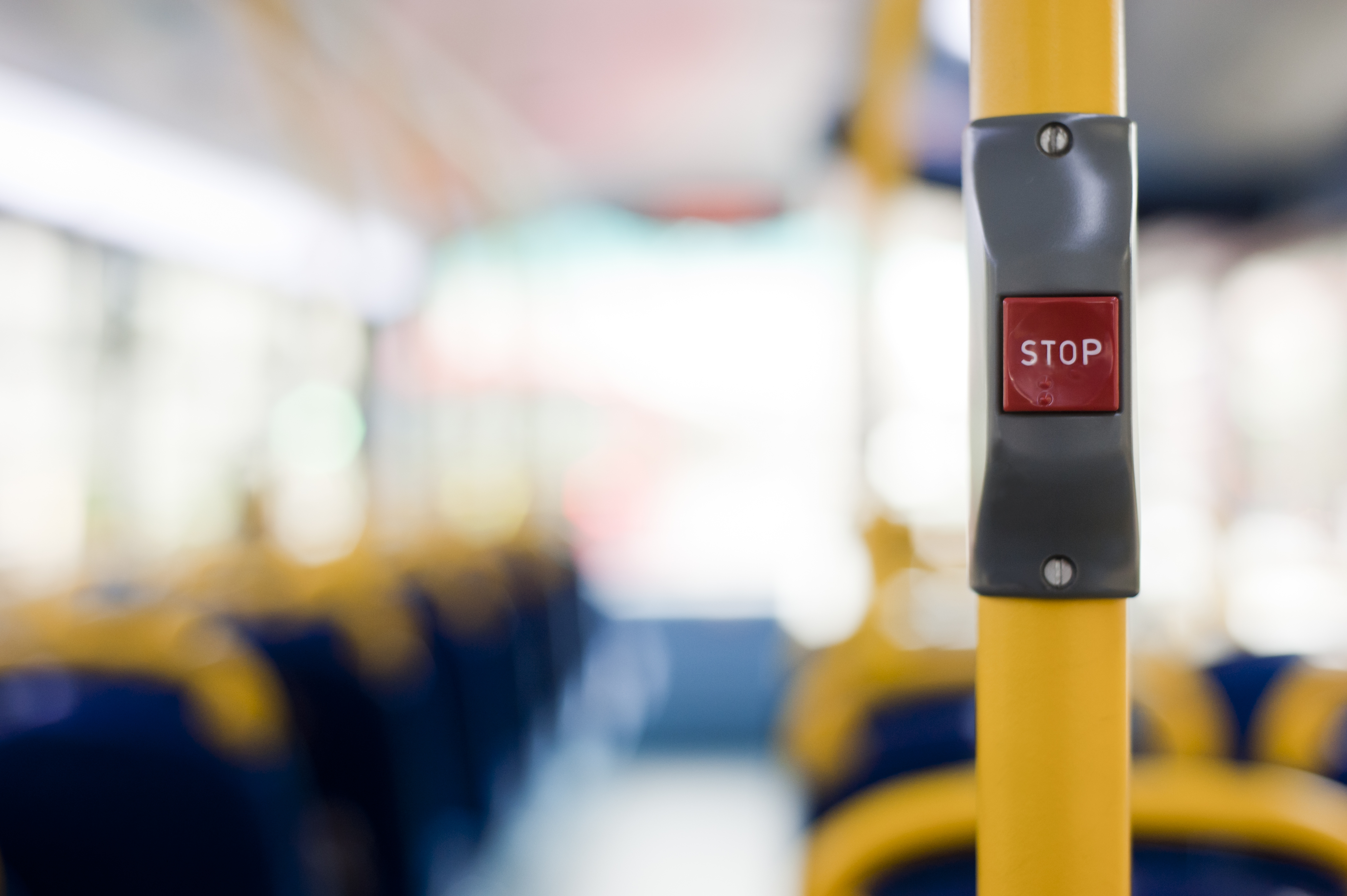 London's double decker bus stop button to push for getting off at the next bus stop.