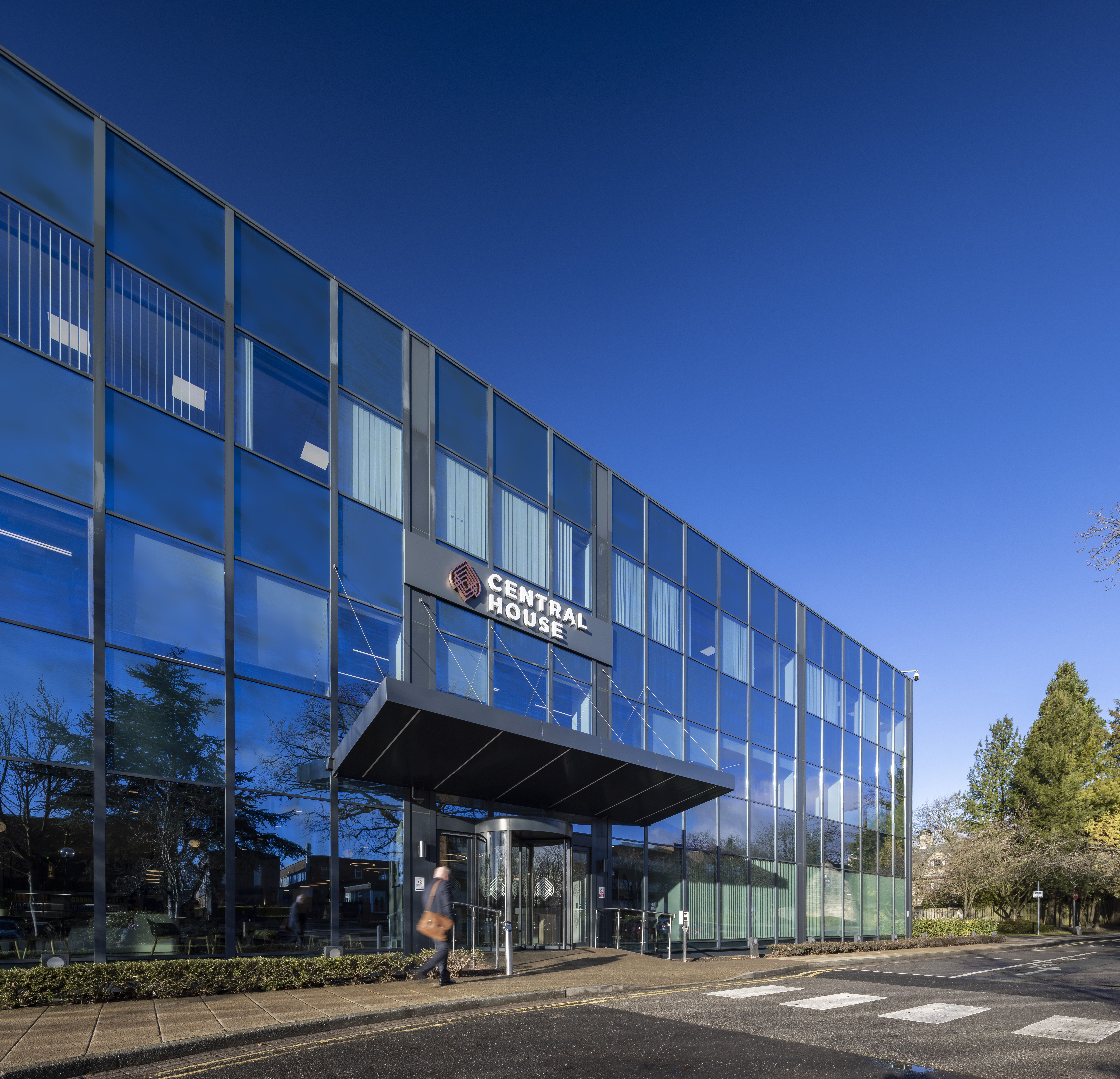 Aldgate Tower, T1. Image shows a tall glass building. 