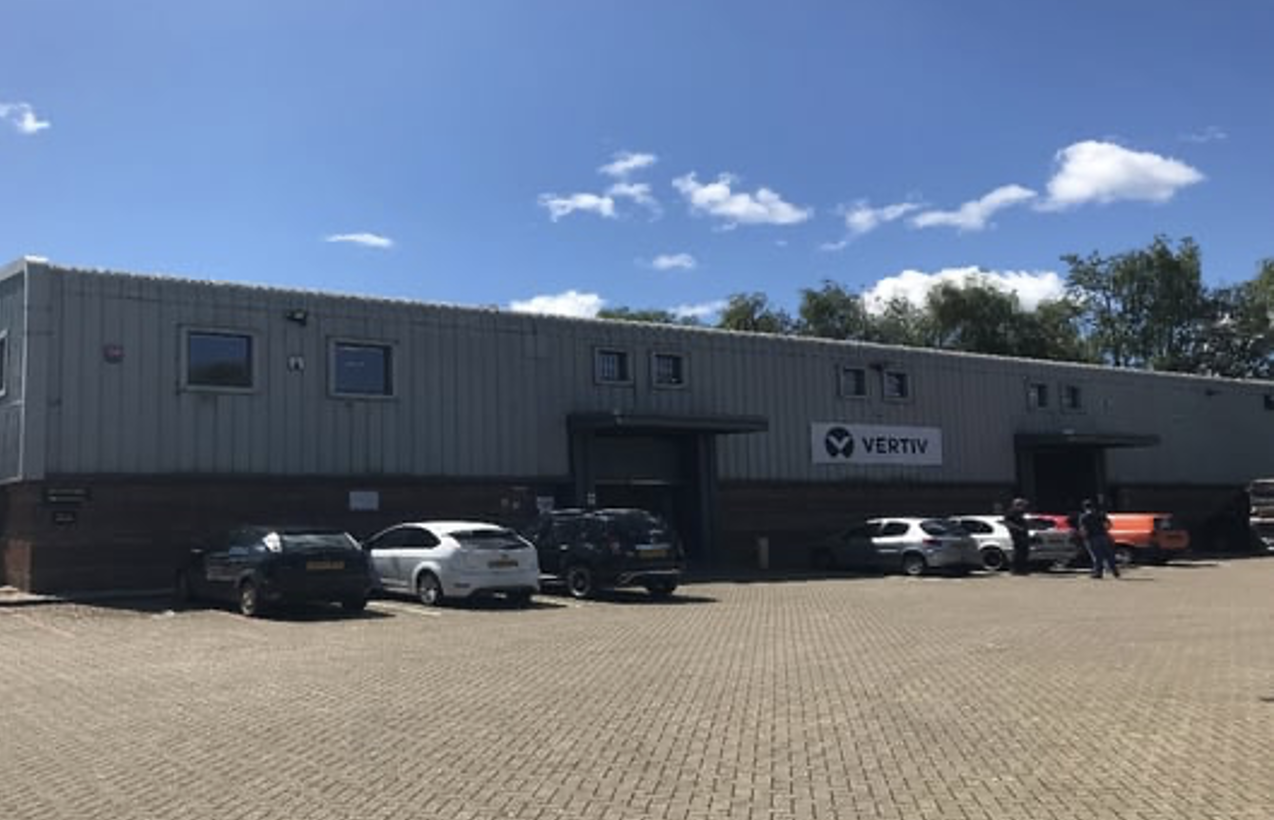 Sunset view of brick buildings alongside a water channel in the central Birmingham, England