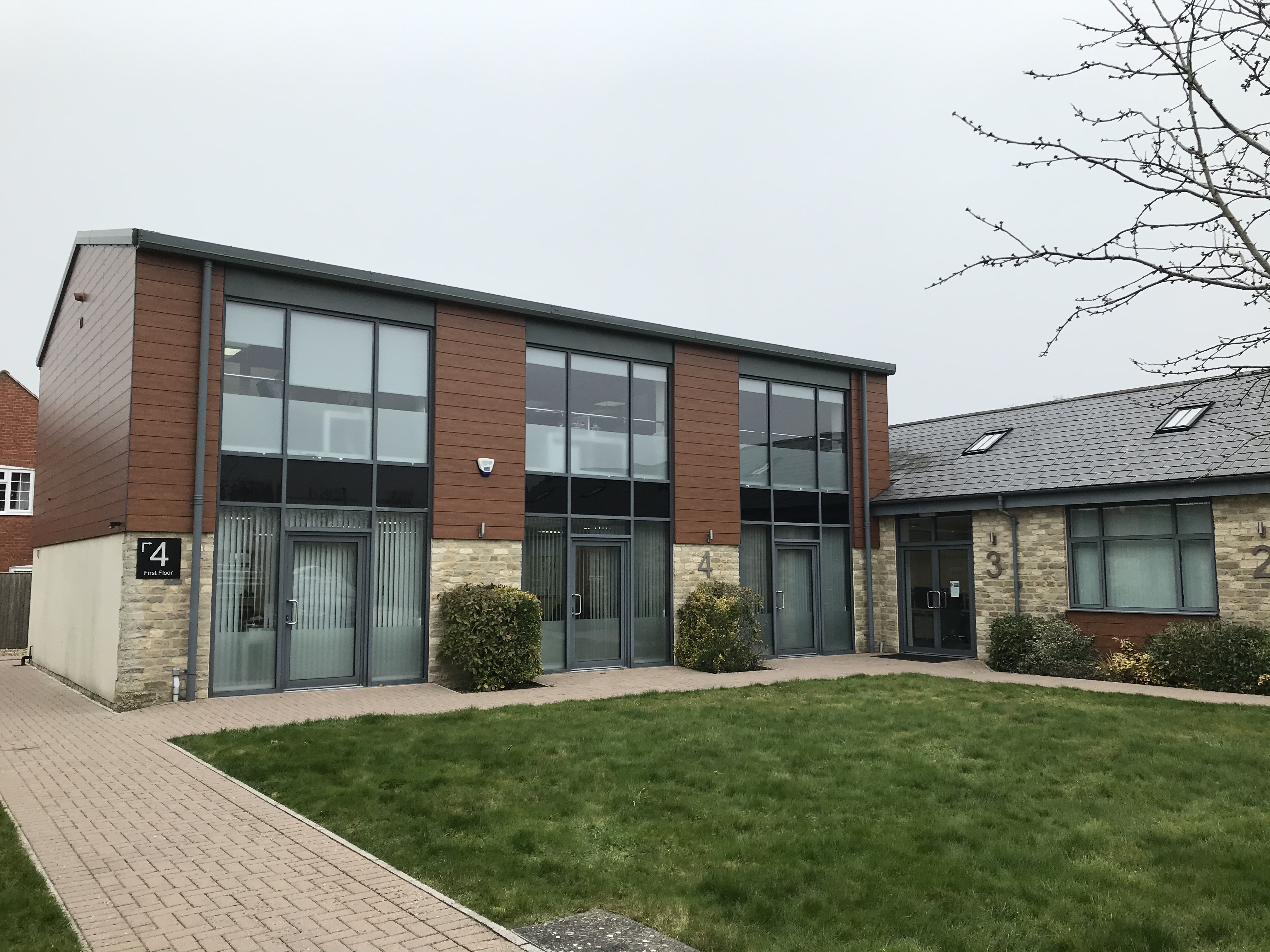 Sunset view of brick buildings alongside a water channel in the central Birmingham, England