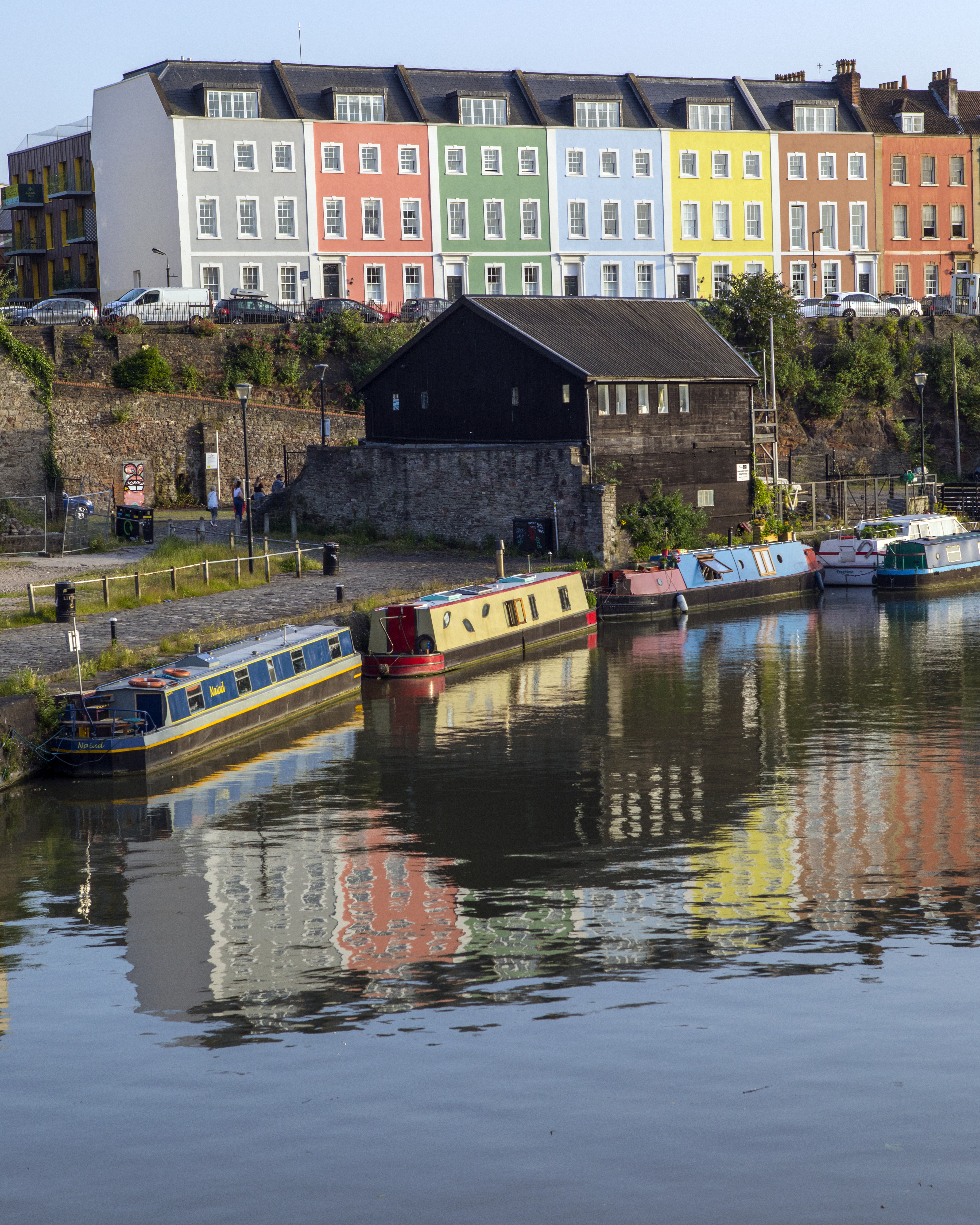 Bristol, UK - June 28th 2019: Looking across the River Avon towards the colourful facades of houses in the city of Bristol, England.