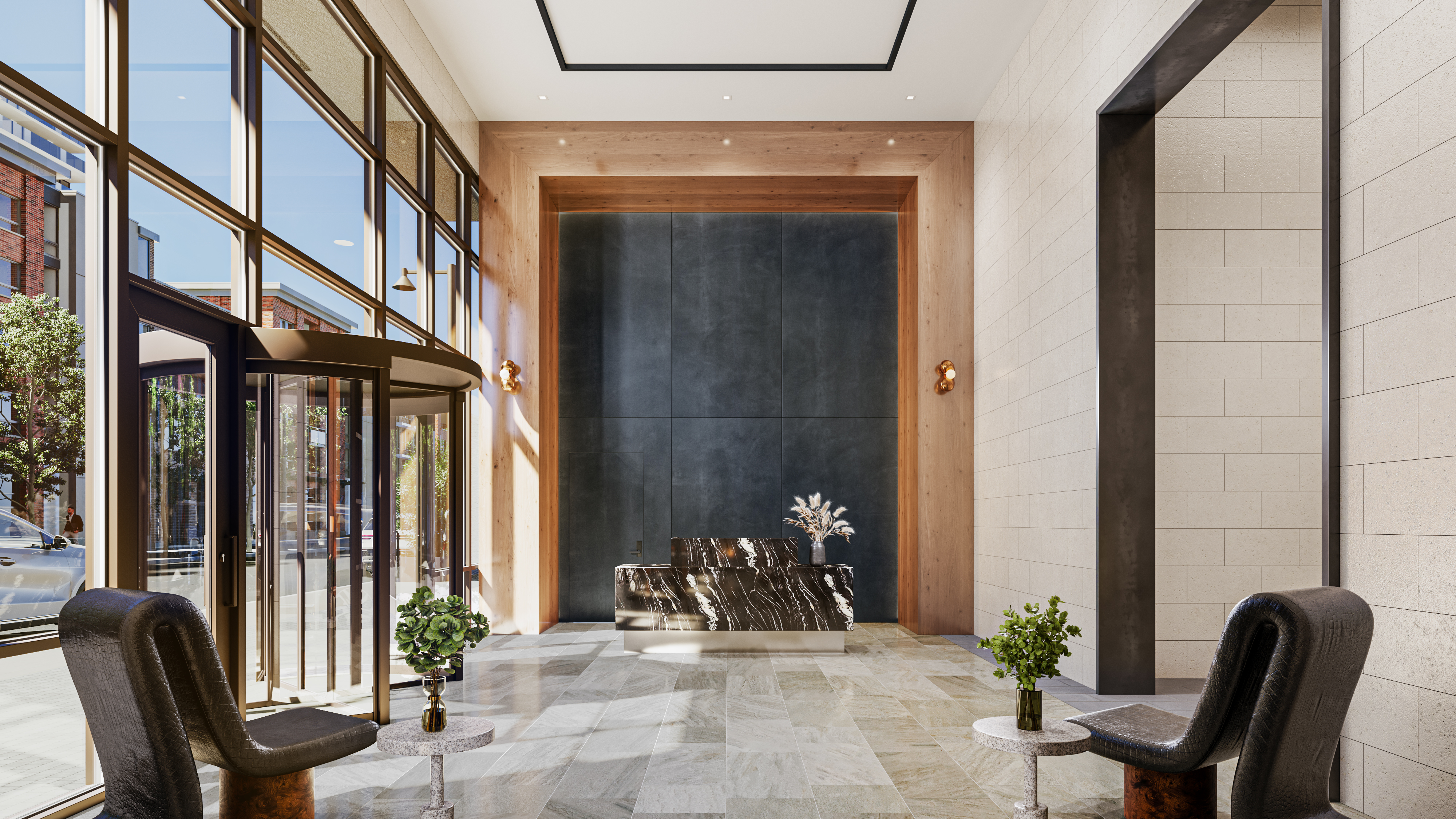 Spacious modern lobby with a revolving glass door, marble reception desk adorned with plants, and black chairs with small tables holding green plants, set against light tile walls and wooden accents.