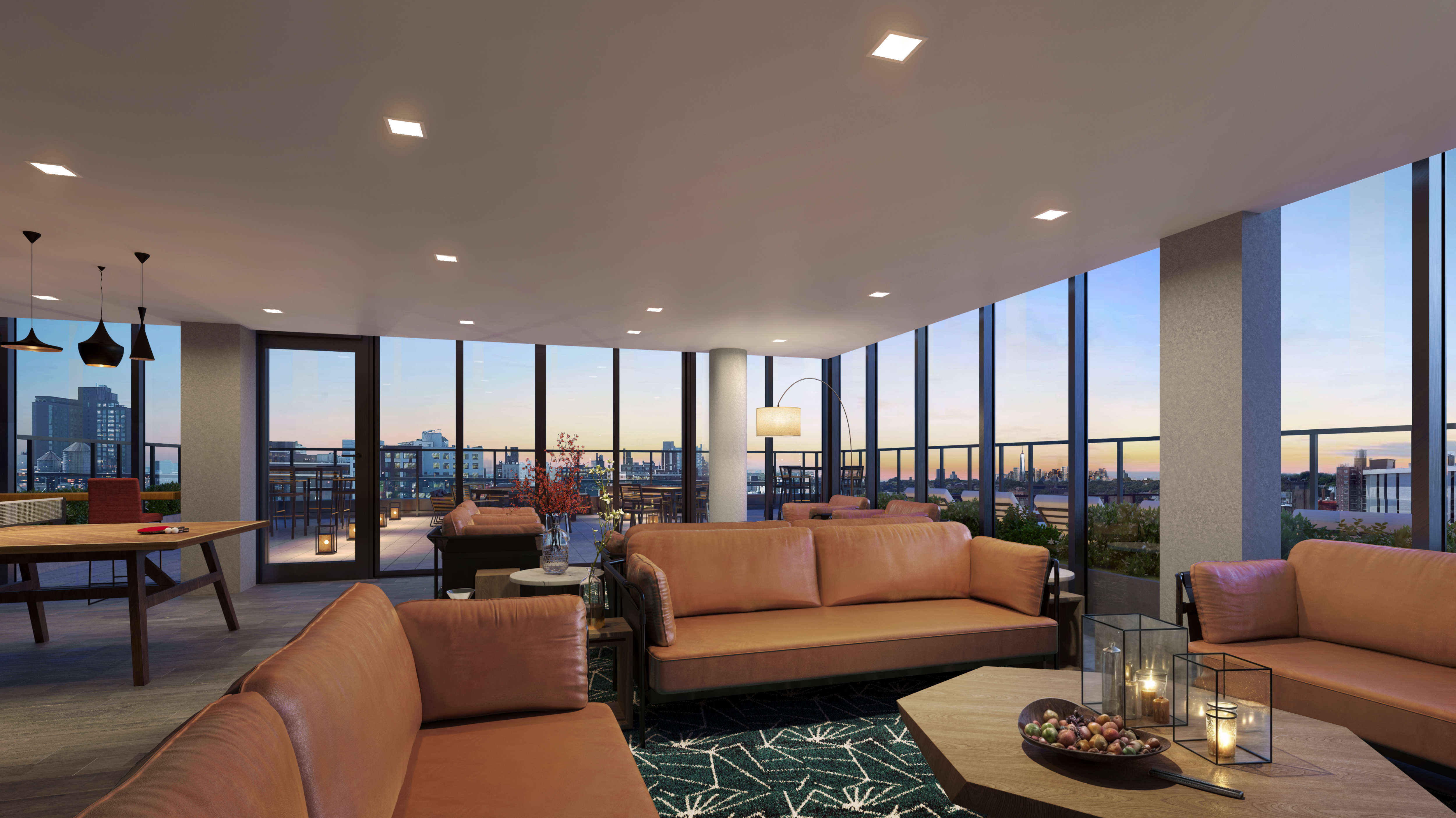 A modern, spacious lounge area with large windows offering a cityscape view at sunset, featuring brown leather sofas, a wooden coffee table with decorative items, and contemporary lighting fixtures