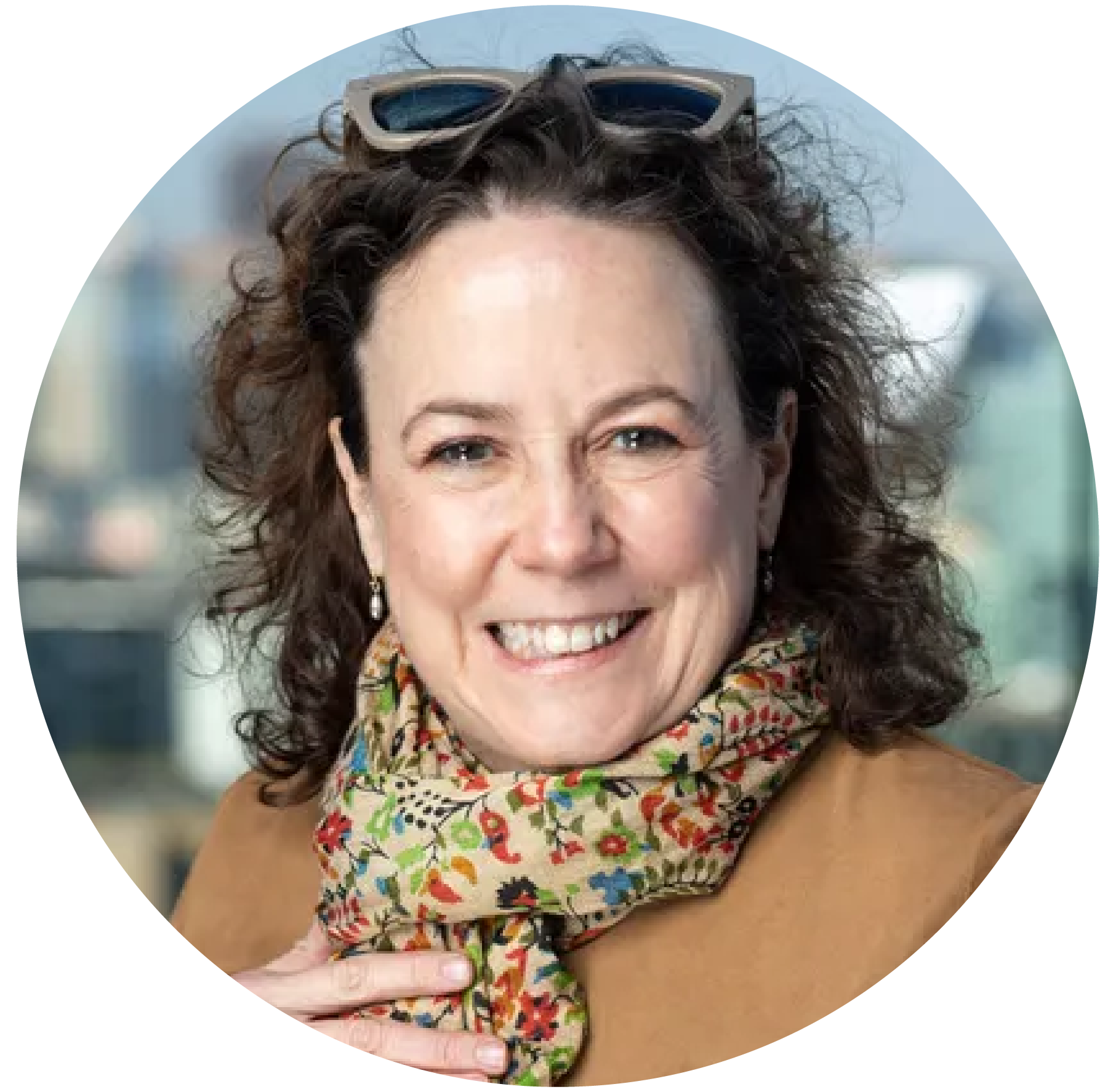 A stylized portrait of Bonnie Spindler, a woman with short hair and a warm expression, illustrated in a graphic art style.