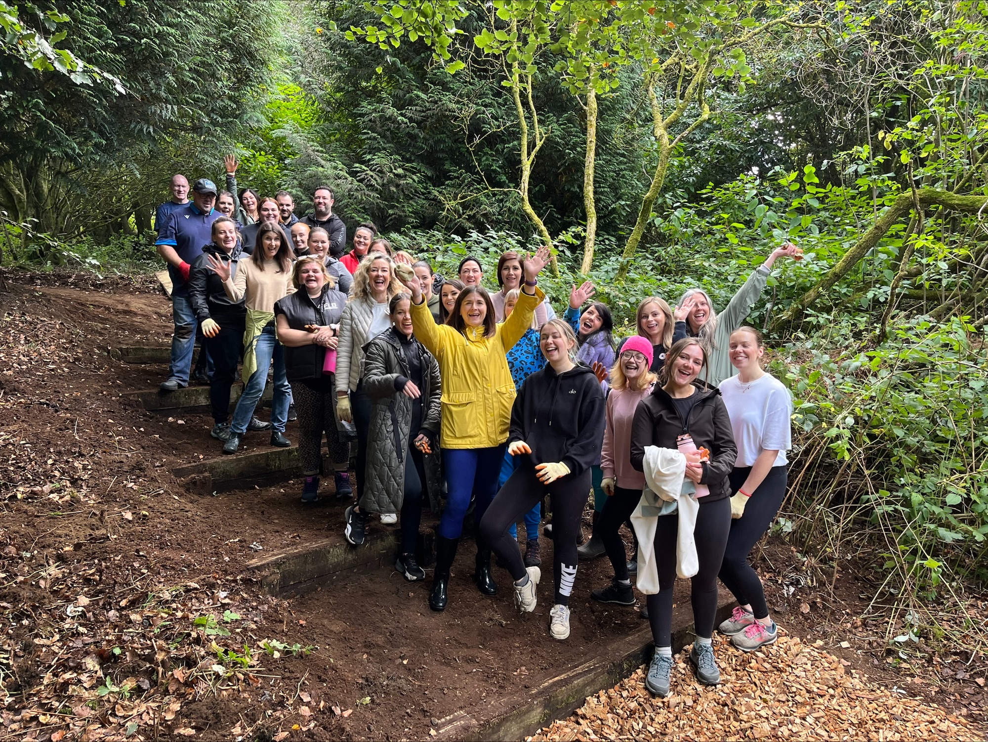 Large group of people on a woodland walk