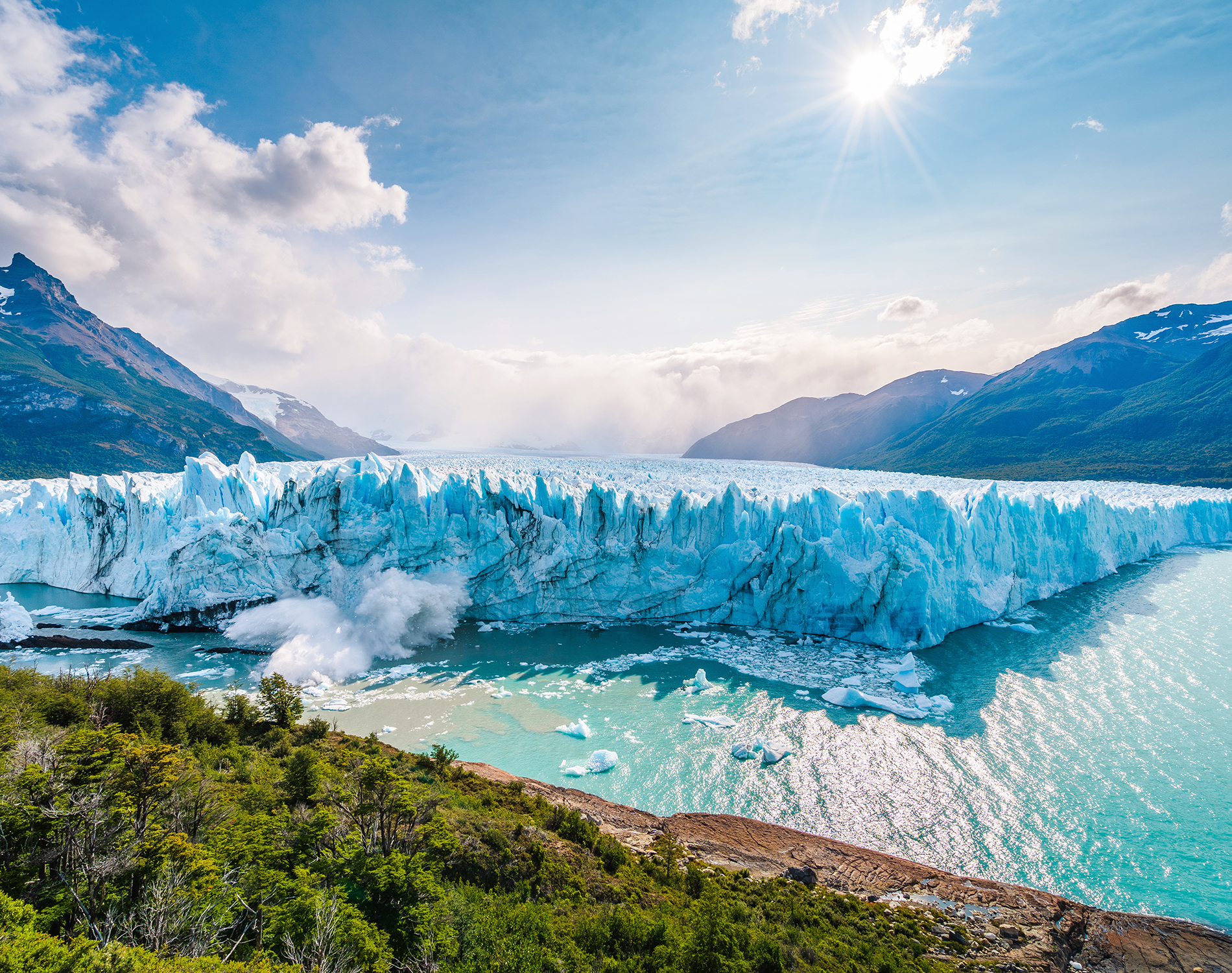 Foot of a glacier set against a blue sky