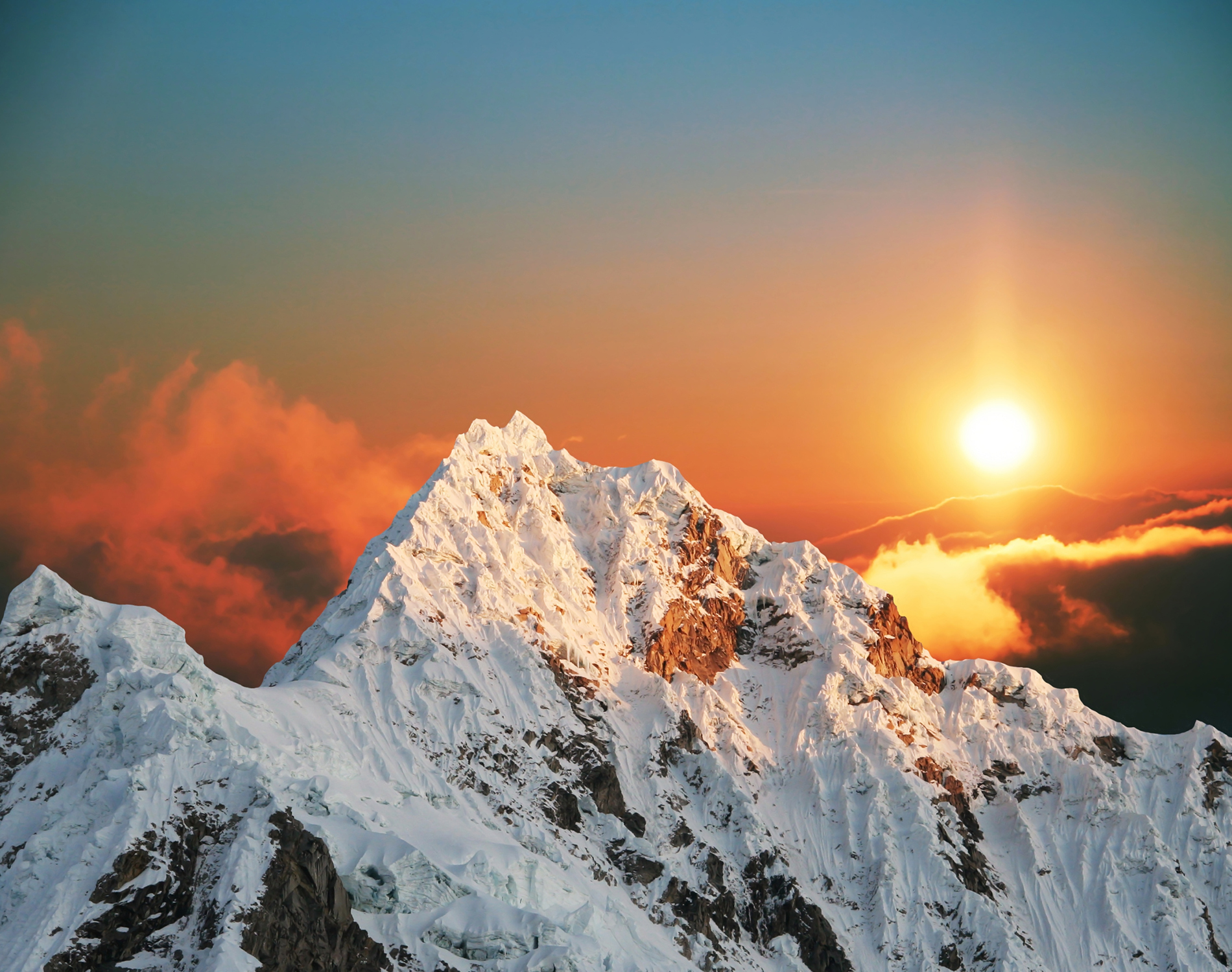 Snow capped mountains at sunrise