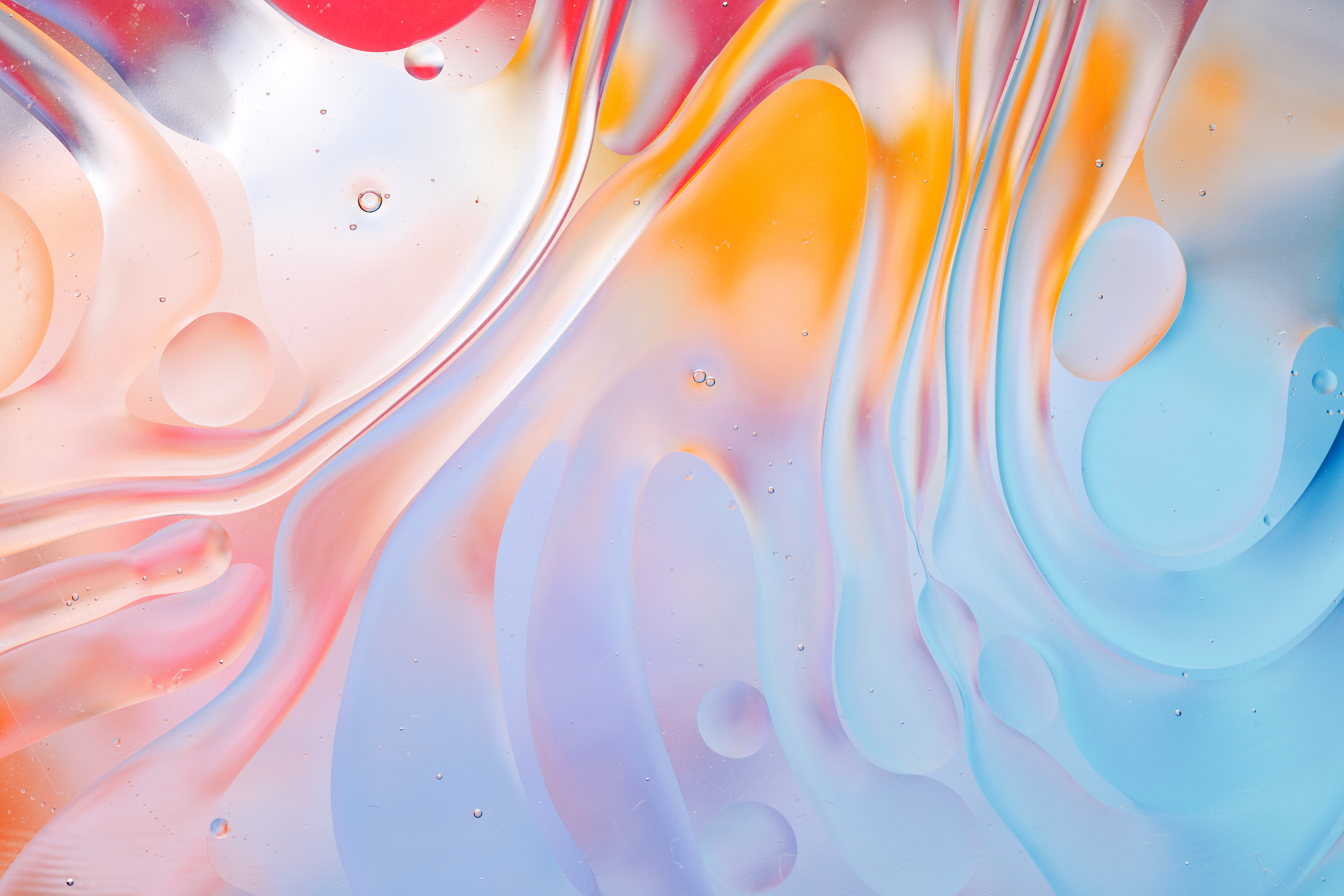 Colourful oil drops on the water surface