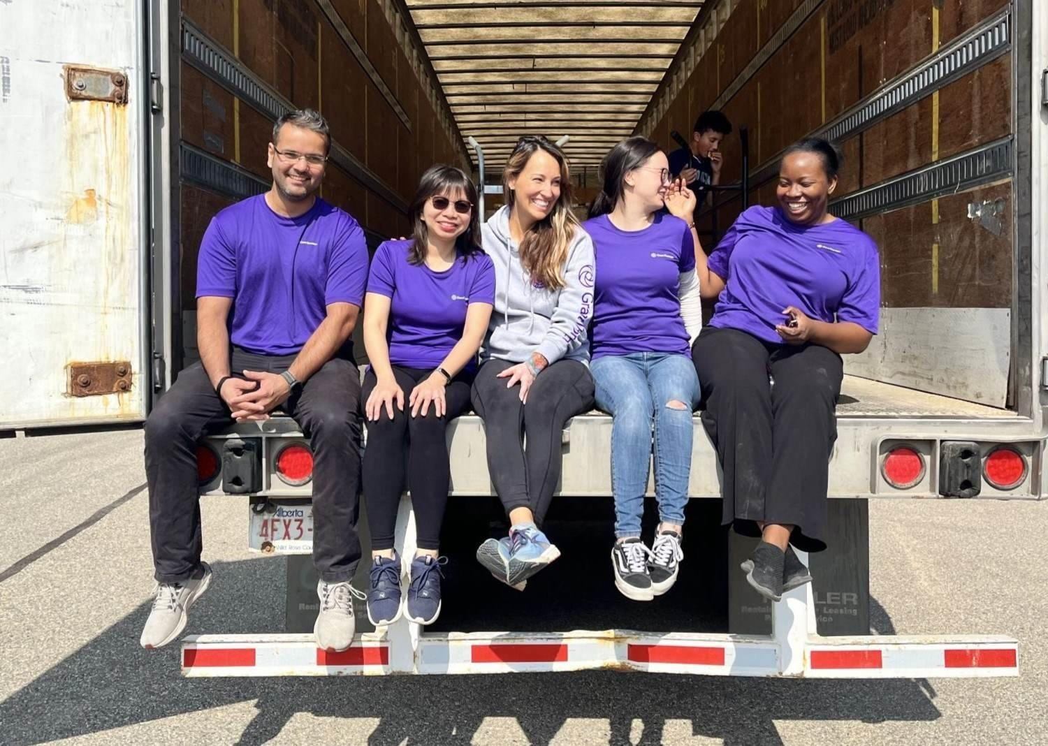 Team Doane Grant Thornton Foundation – united in purpose and purple! Captured on the edge of action, with five in signature purple and one in a standout grey hoodie, ready to roll. #Teamwork #FoundationStrong #PurplePride