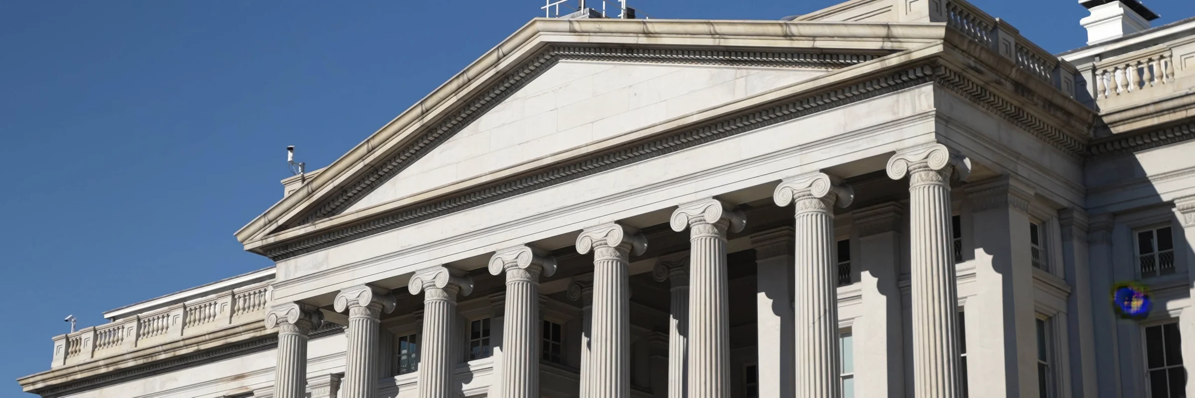 An image of the front facade of the US Treasury Building