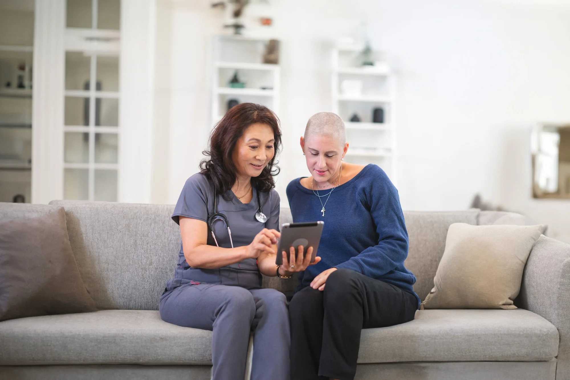 Doctor visiting a cancer patient at her home
