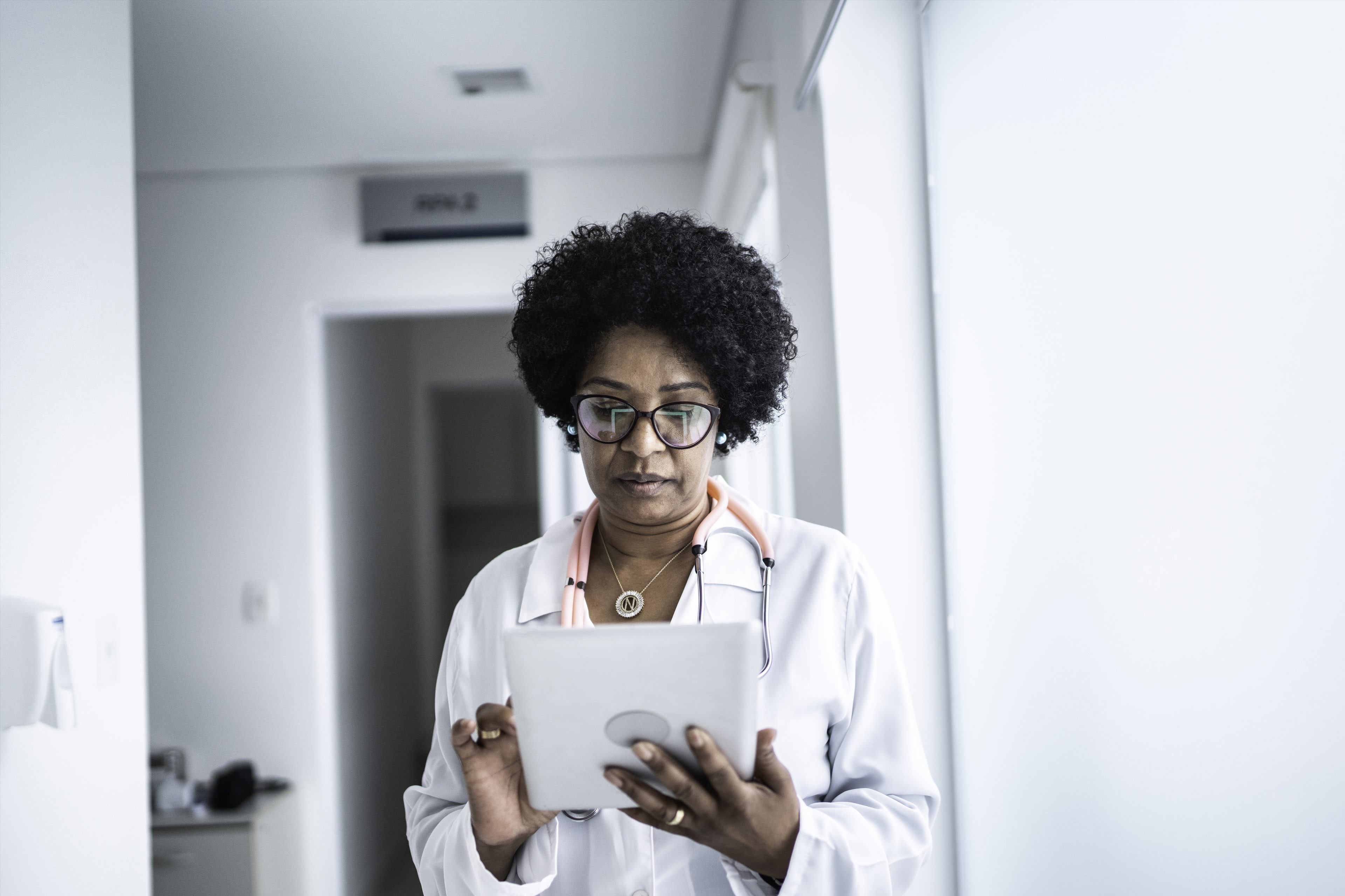 Female doctor using a digital tablet at a medical office