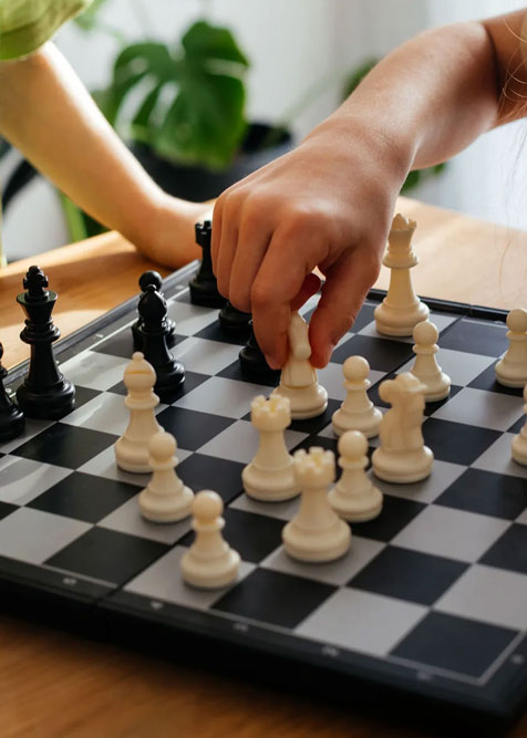 A close-up image of two people playing in a chess match