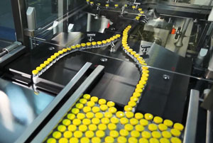 An automated assembly line for organizing bottles of drugs