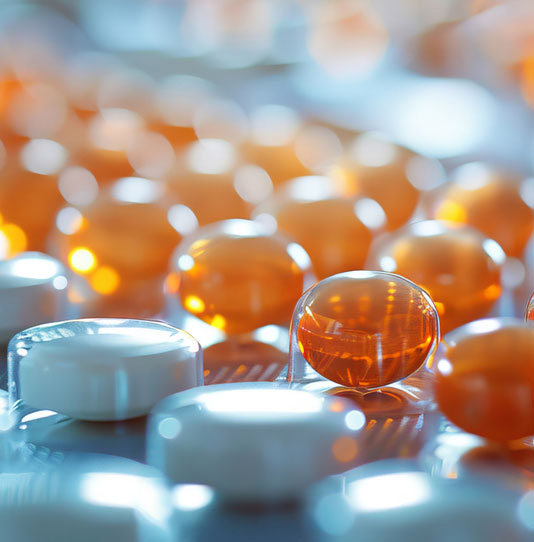 A close up shot of capsule pills on an assembly line