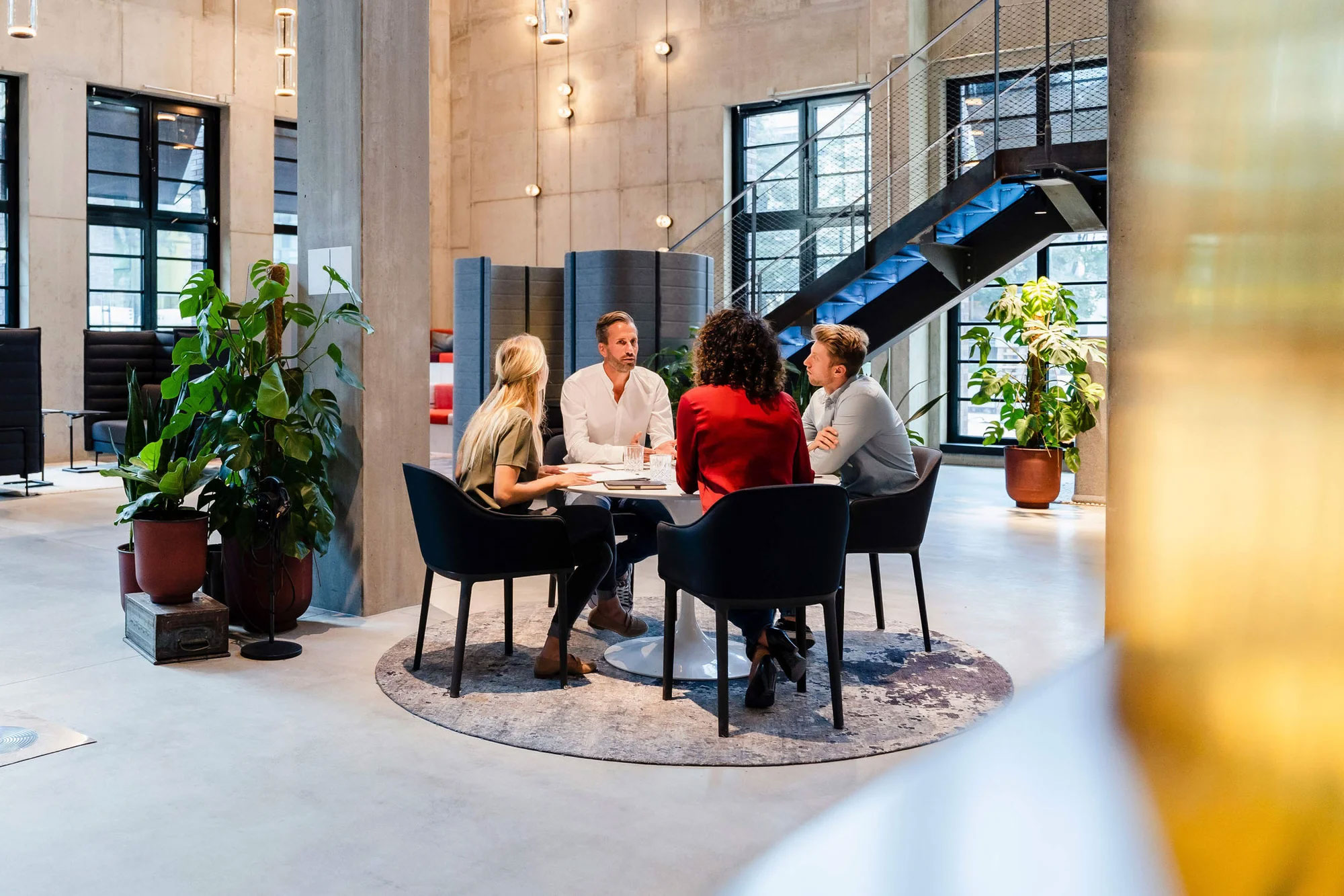 Co-workers working together in meeting at office