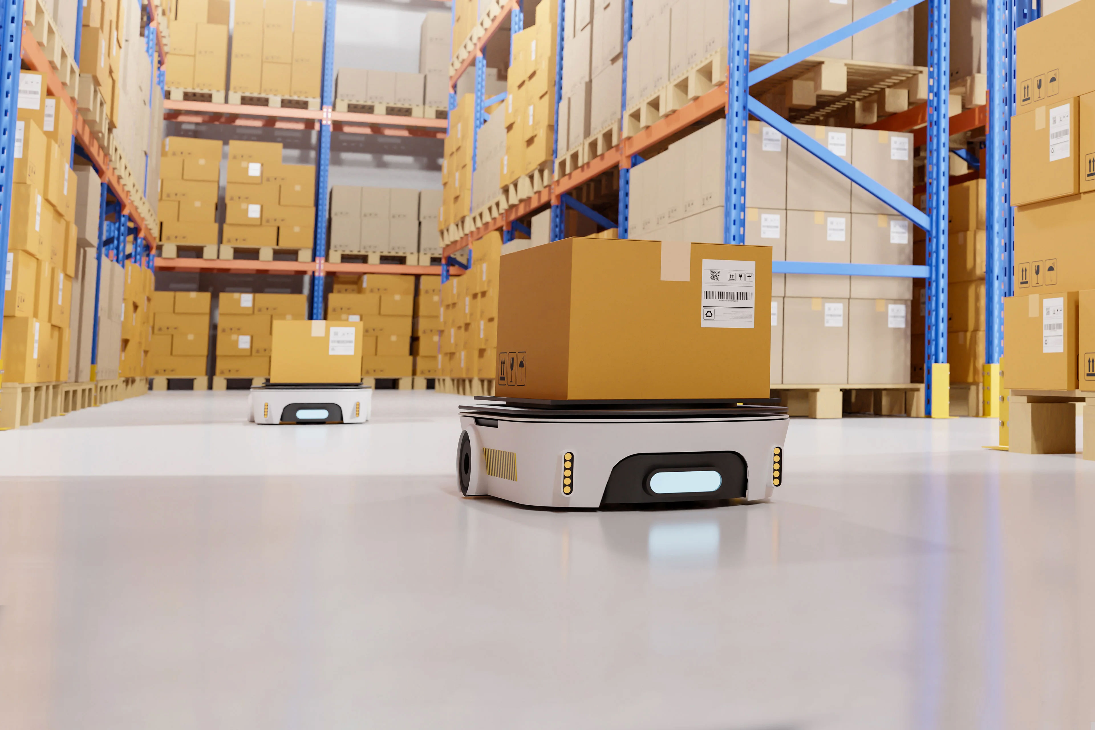 Image of a automated robot carrying a shipping box inside a warehouse