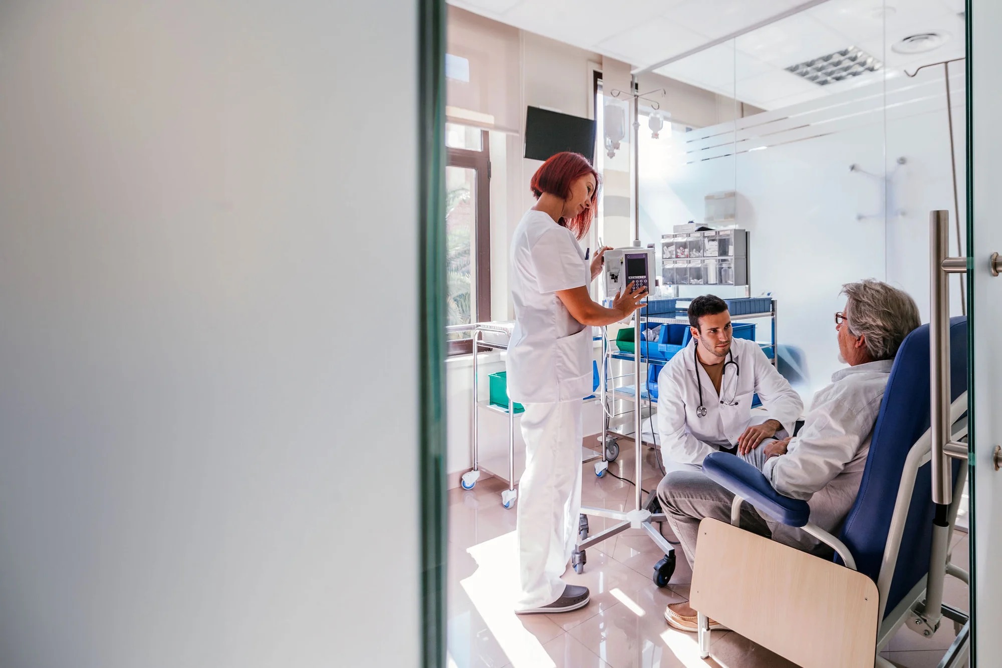 Medics and patient in during an oncology treatment