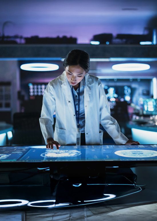 An image of a neuroscientist using an interactive touch screen table in a lab