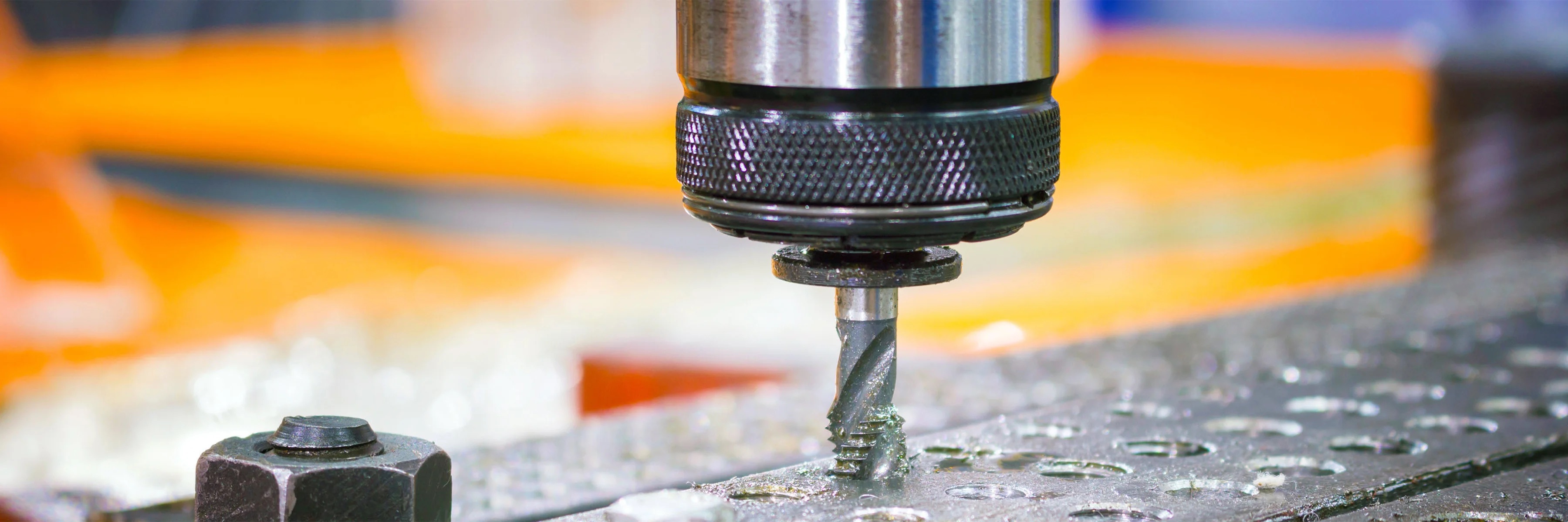 Manufacturing tapping tool in spindle drilling into steel