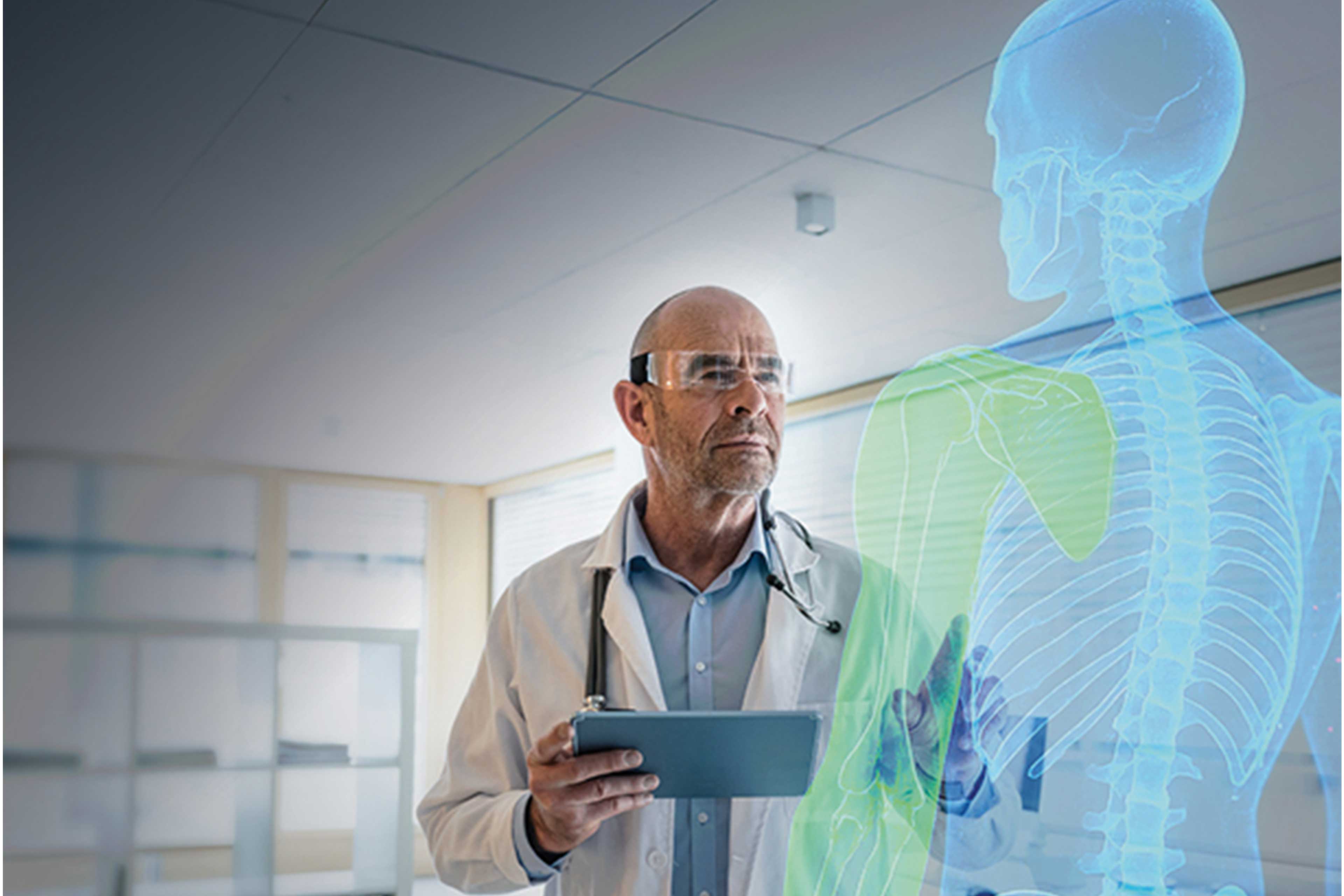 An image of a scientist wearing a lab coat and goggles interacting with a virtual reality model of a human skeleton
