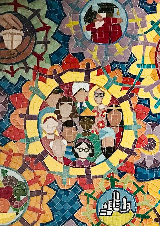 An image of a scientist wearing a lab coat and goggles interacting with a virtual reality model of a human skeleton