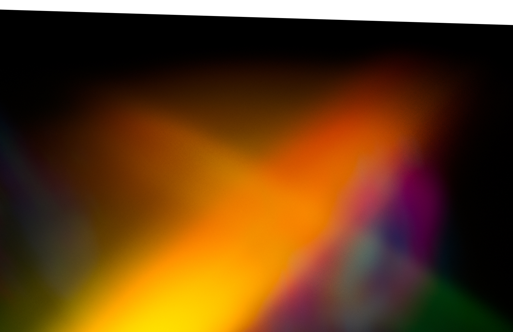 Colorful spectrum of light in blues, oranges, greens and soft reds across a dark background