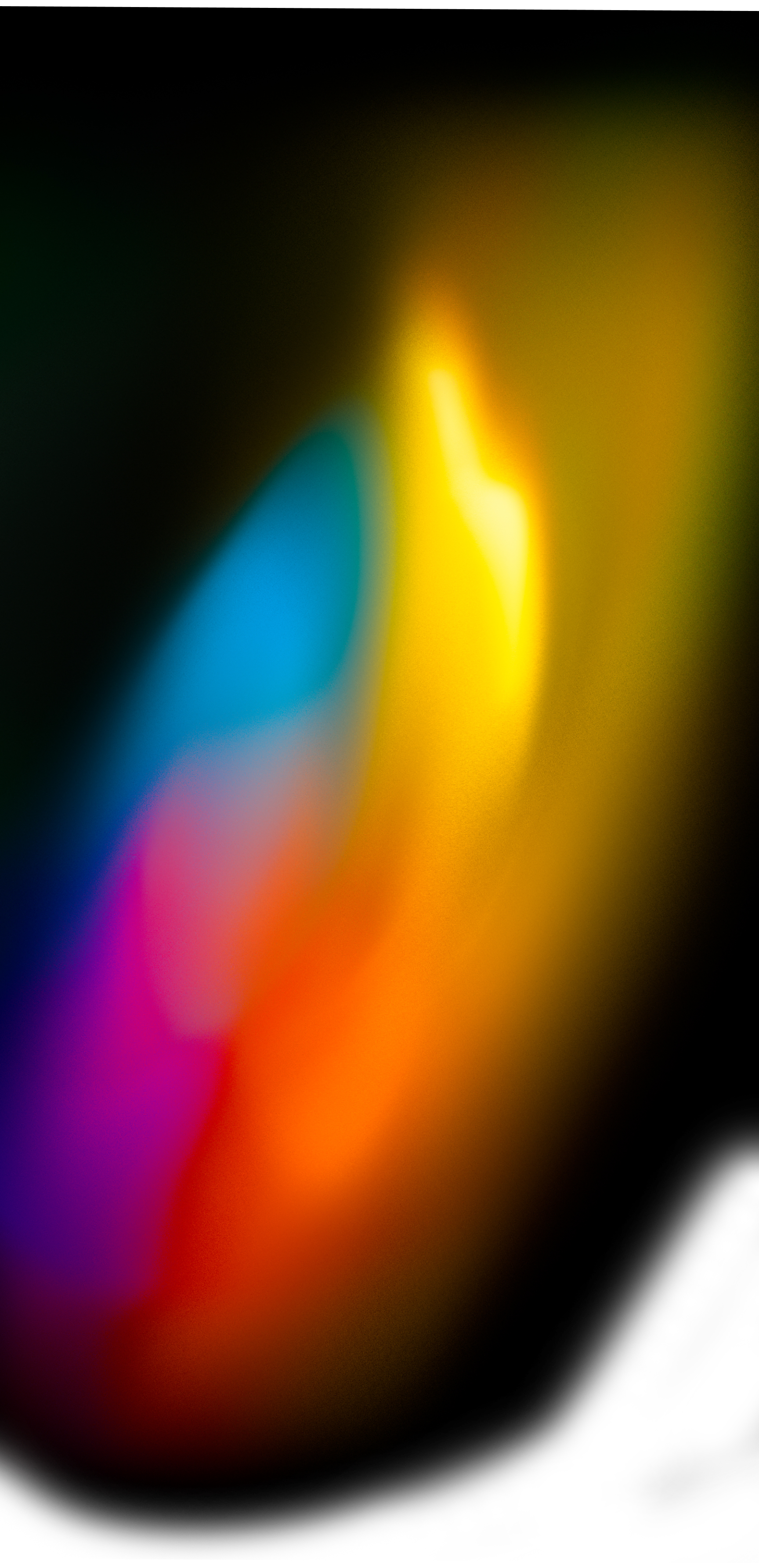 Colorful spectrum of light in blues, oranges, greens and soft reds across a dark background