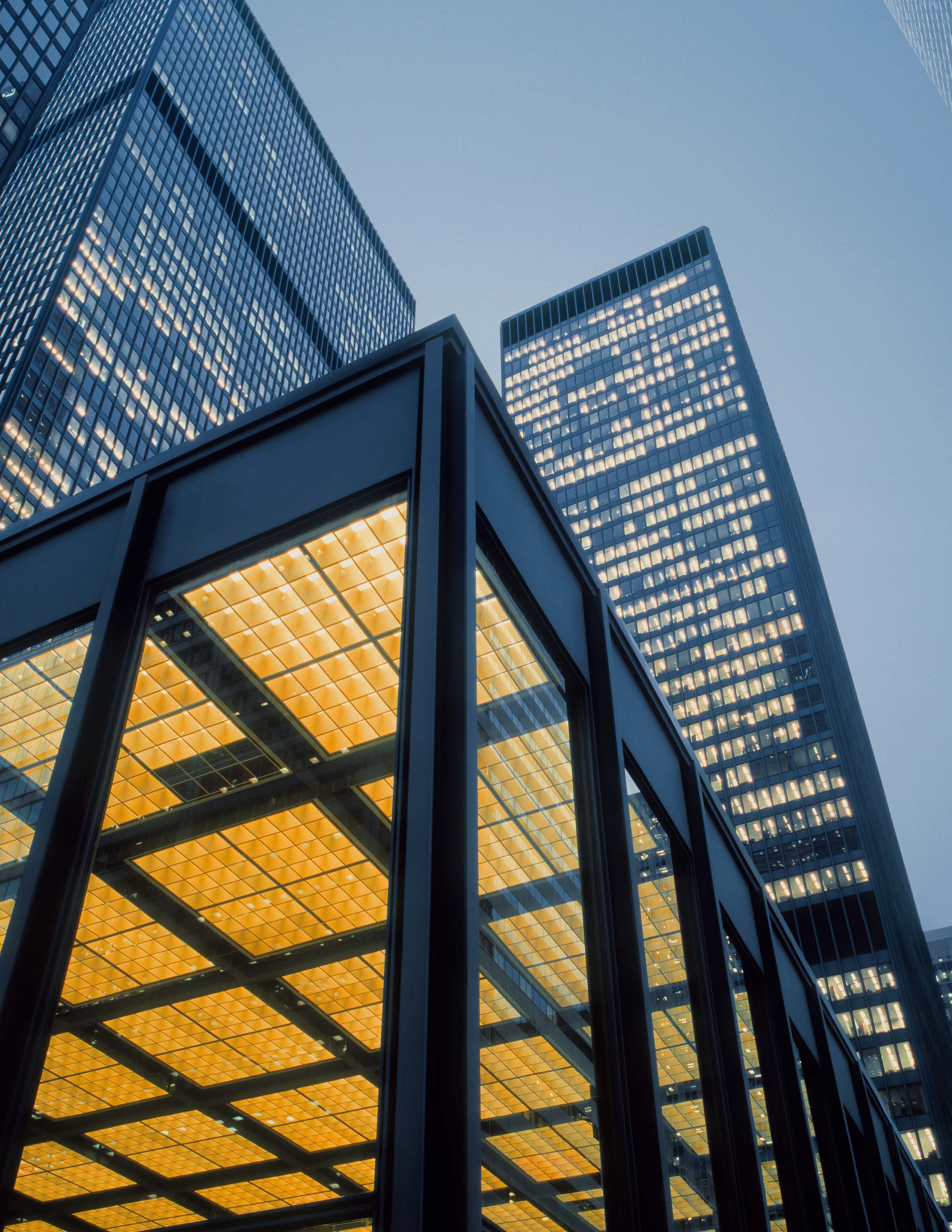 Image looking upward towards an international architectural style skyscraper