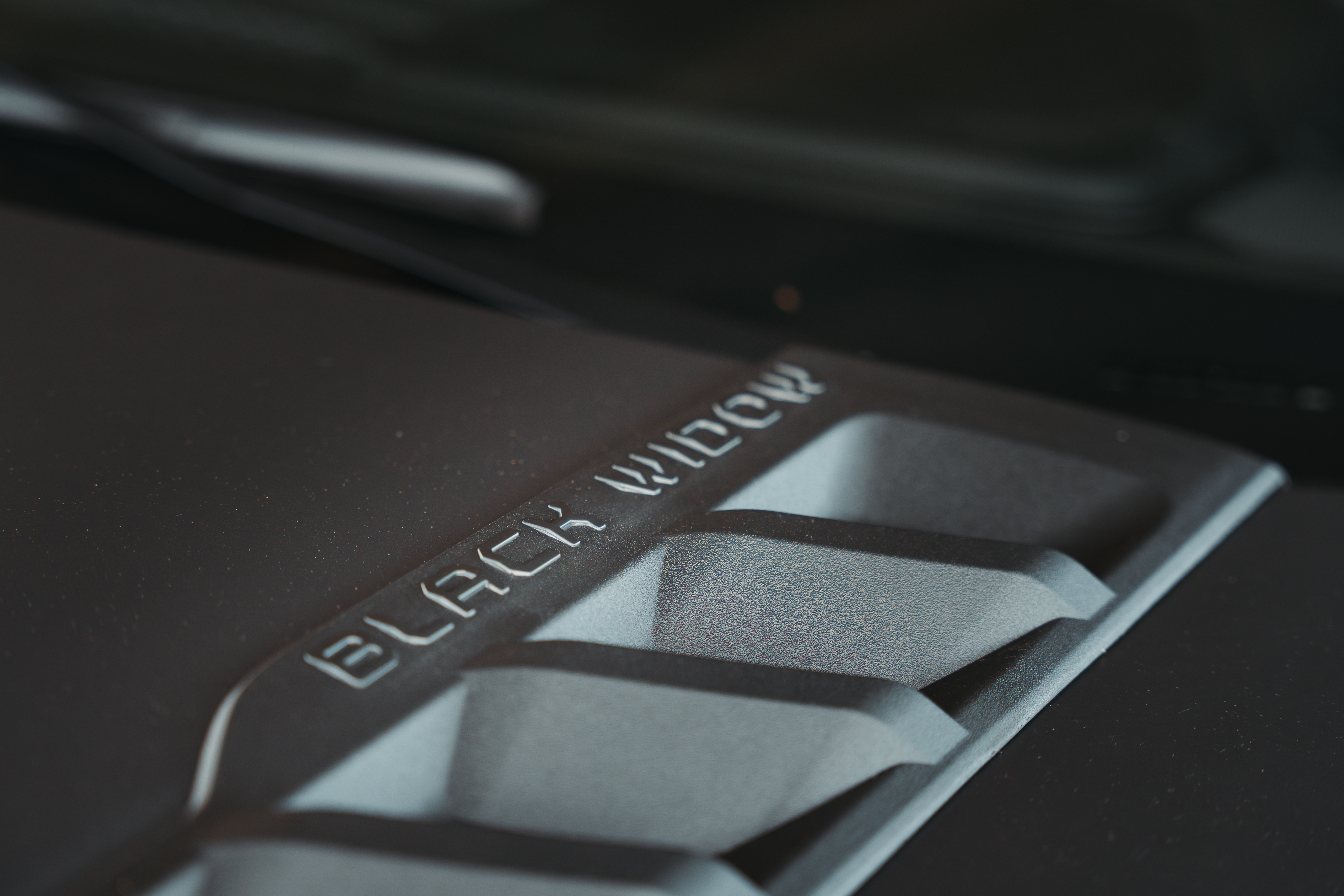 Black Widow Truck custom hood vents on matte grey chevrolet silverado 1500, and Black Widow Badging. 