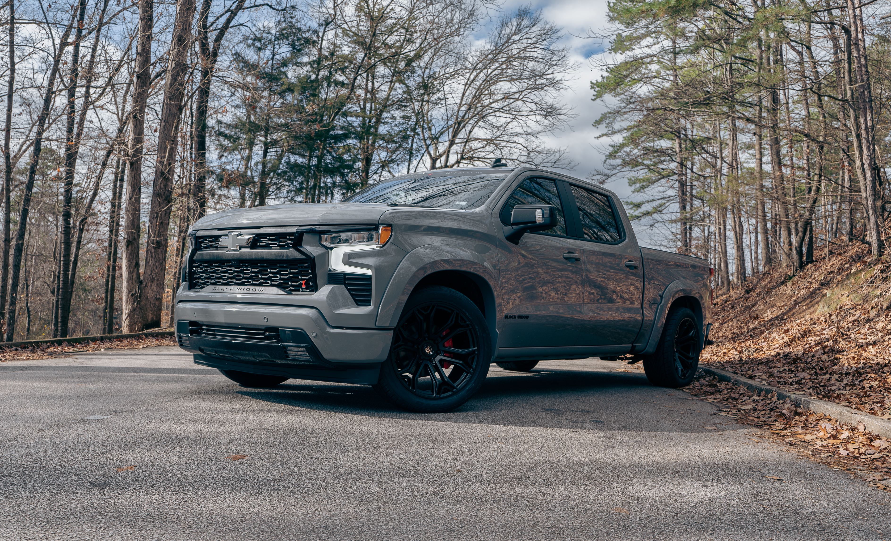 Lifted Silverado 1500 on the ranch with horses