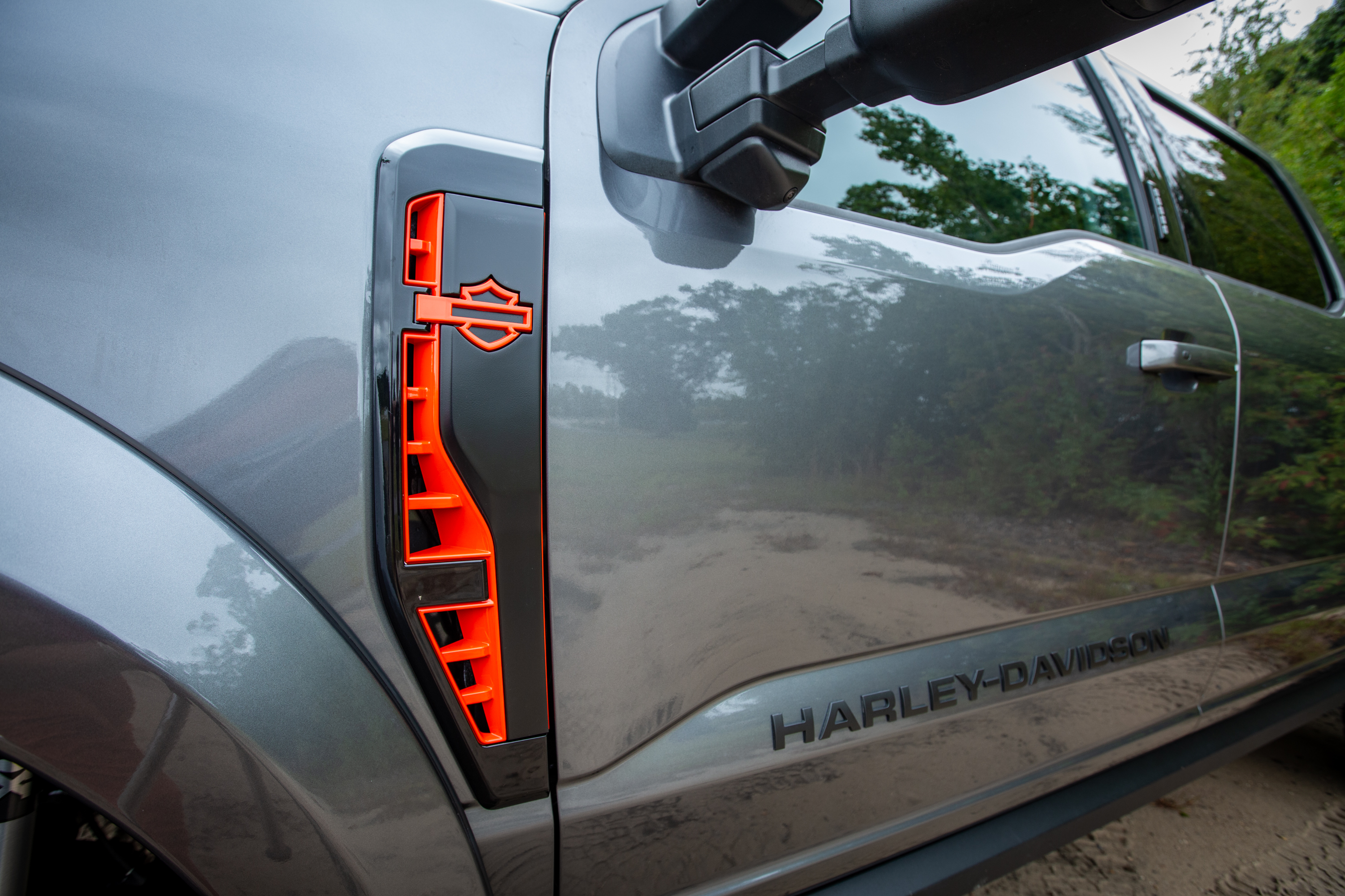 harley-davidson trucks grey superduty ford with orange bar and shield side fender vents