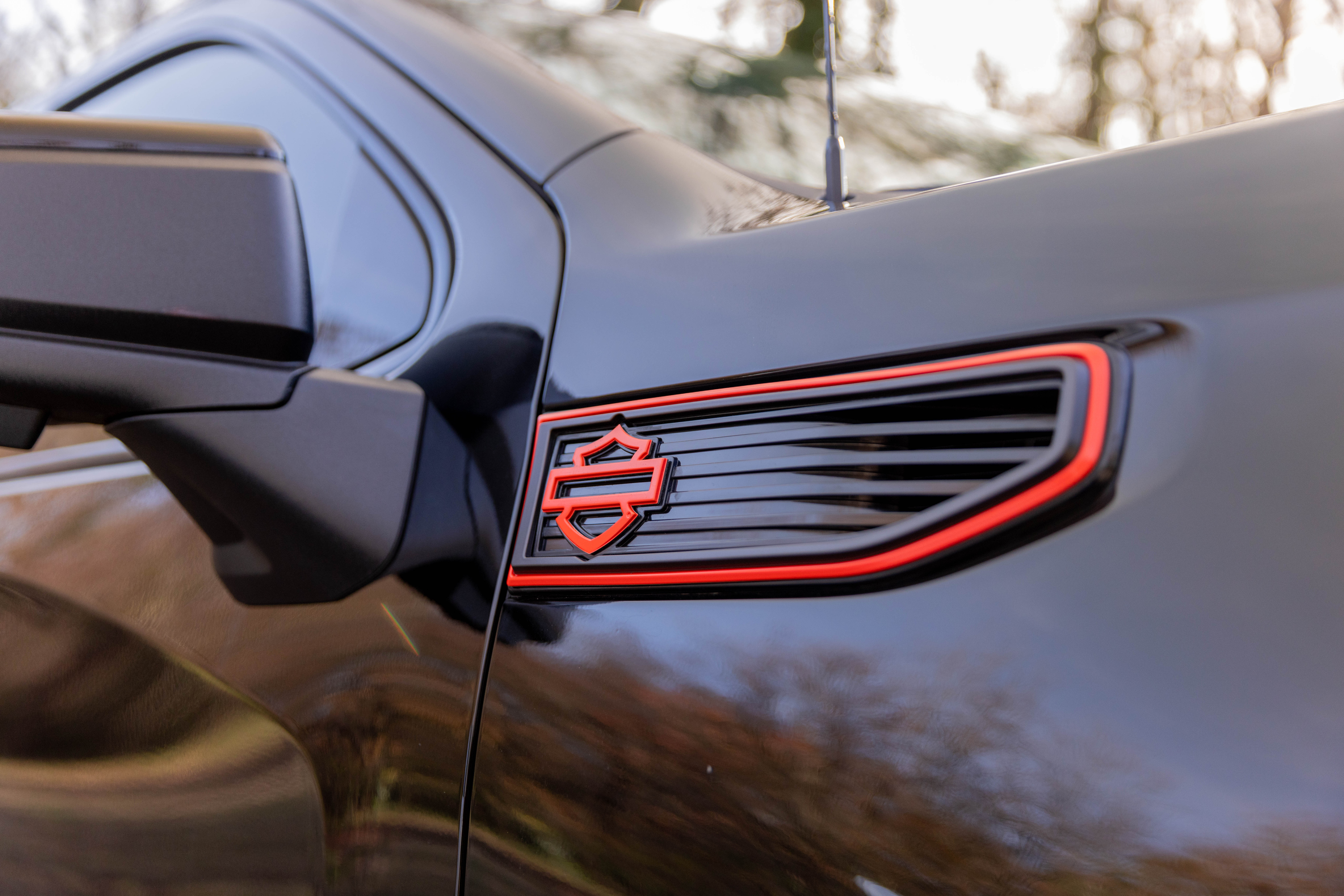 orange bar and shield badging on gmc sierra 1500 - harley-davidson trucks side vents