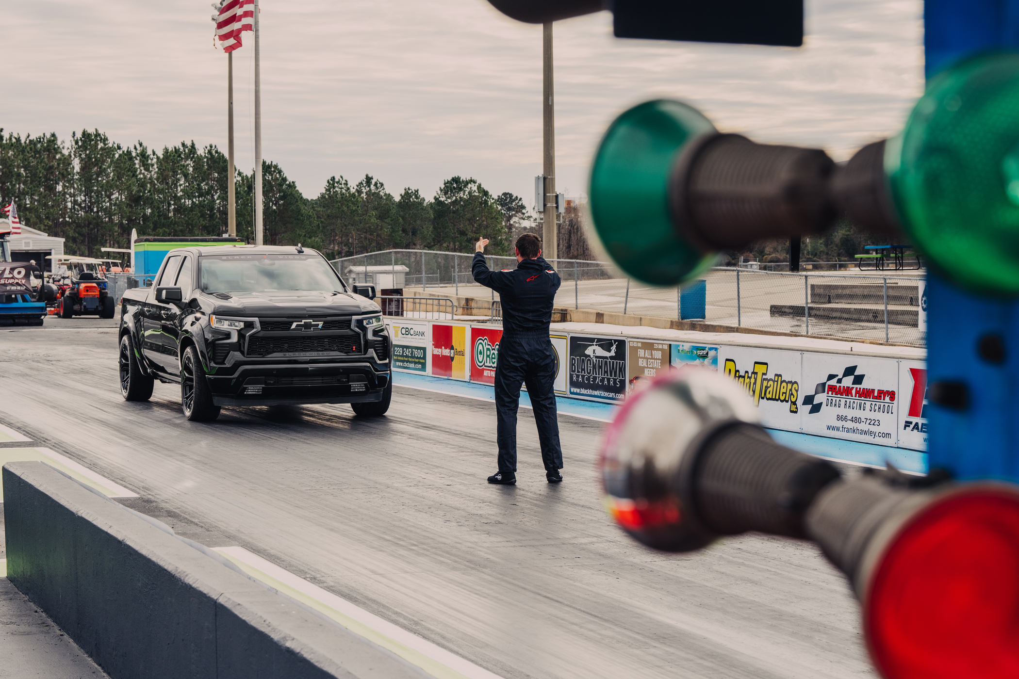 Lifted Silverado 1500 pulling out of the garage.
