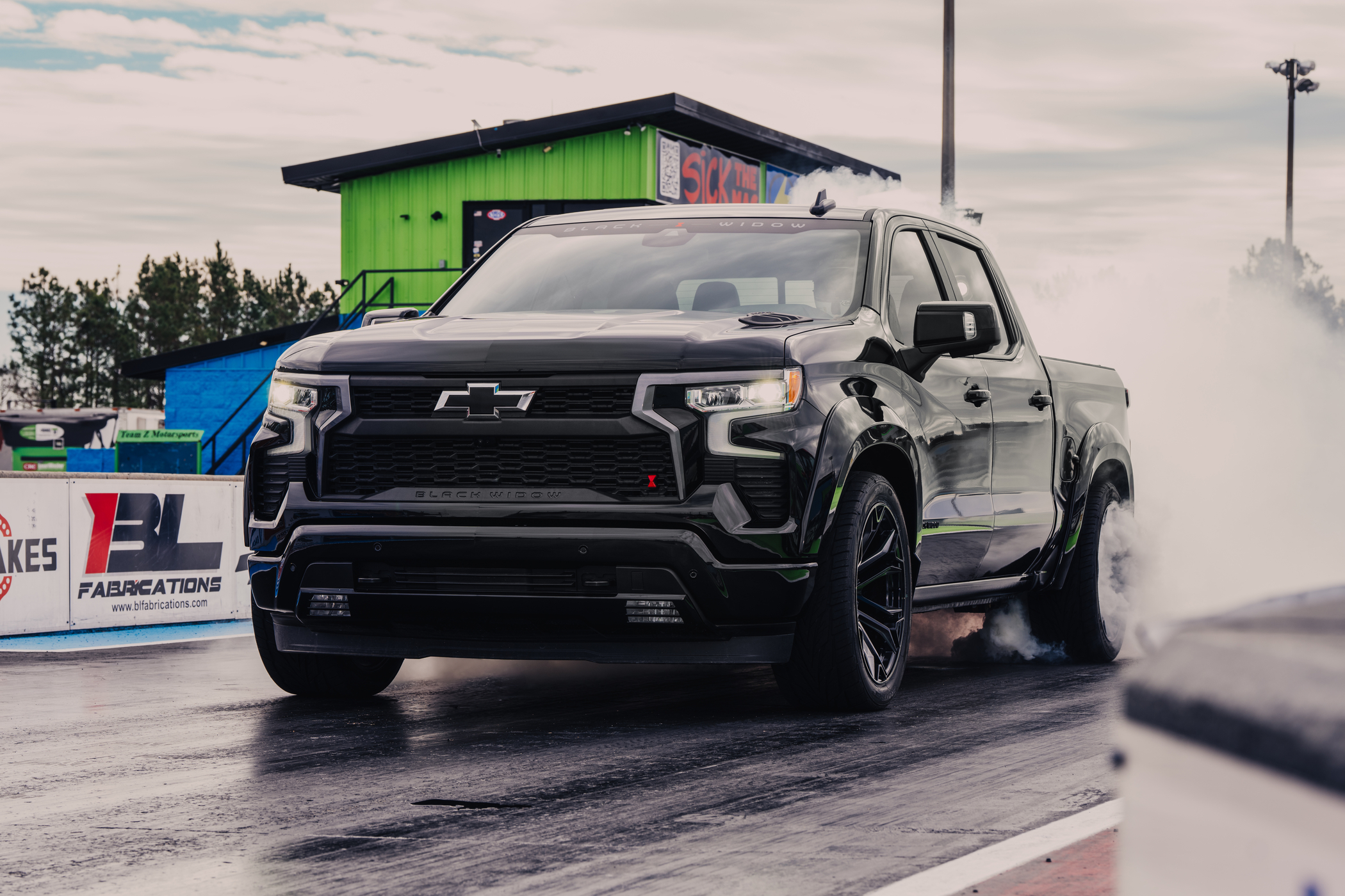 Lowered Black Widow Chevy 1500 drifting