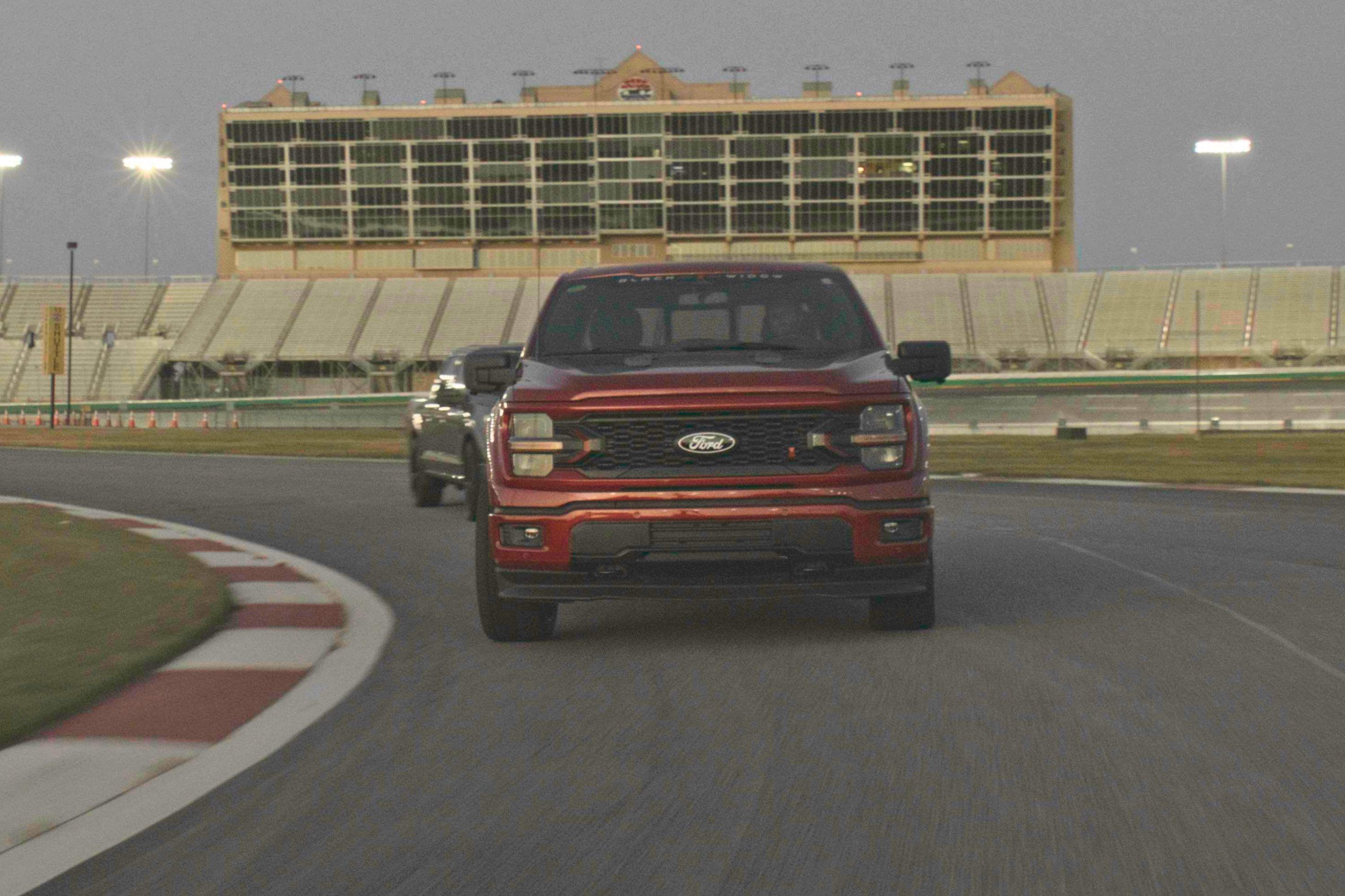 Lowered Black Widow F-150 on a road course