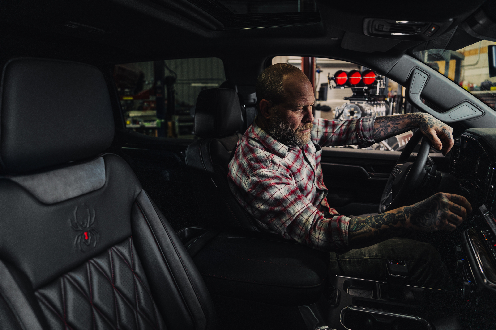 Chevy Silverado Black Widow interior with guy looking at his horse.