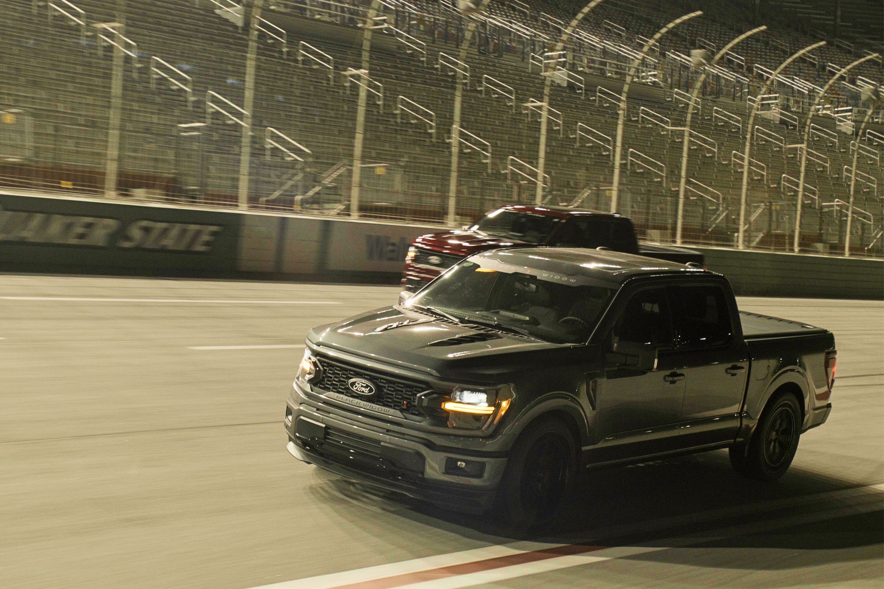 Black Widow Lifted Ford F150 offroad kicking up dust.