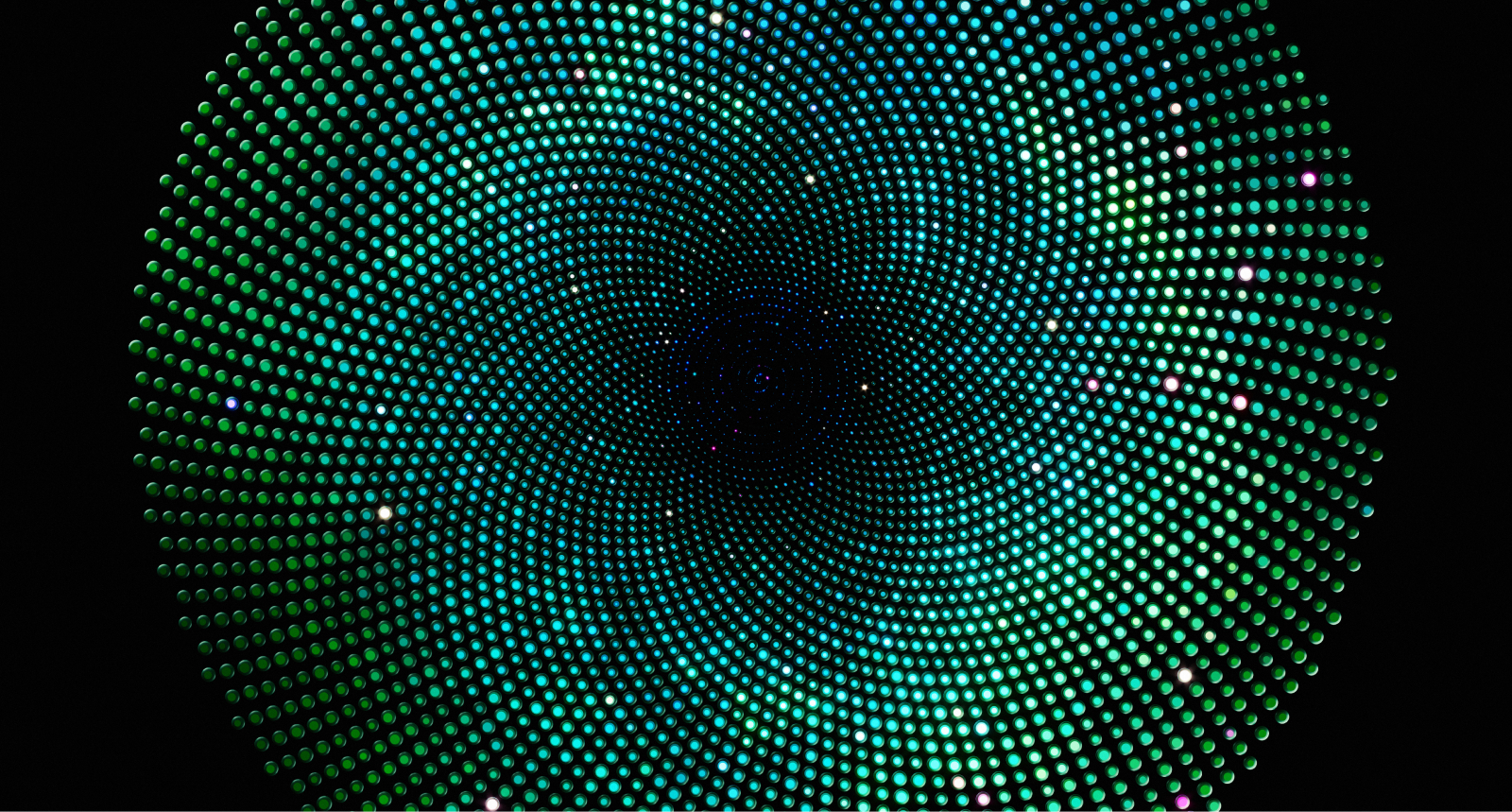 Image of a group of people sitting around a table.	